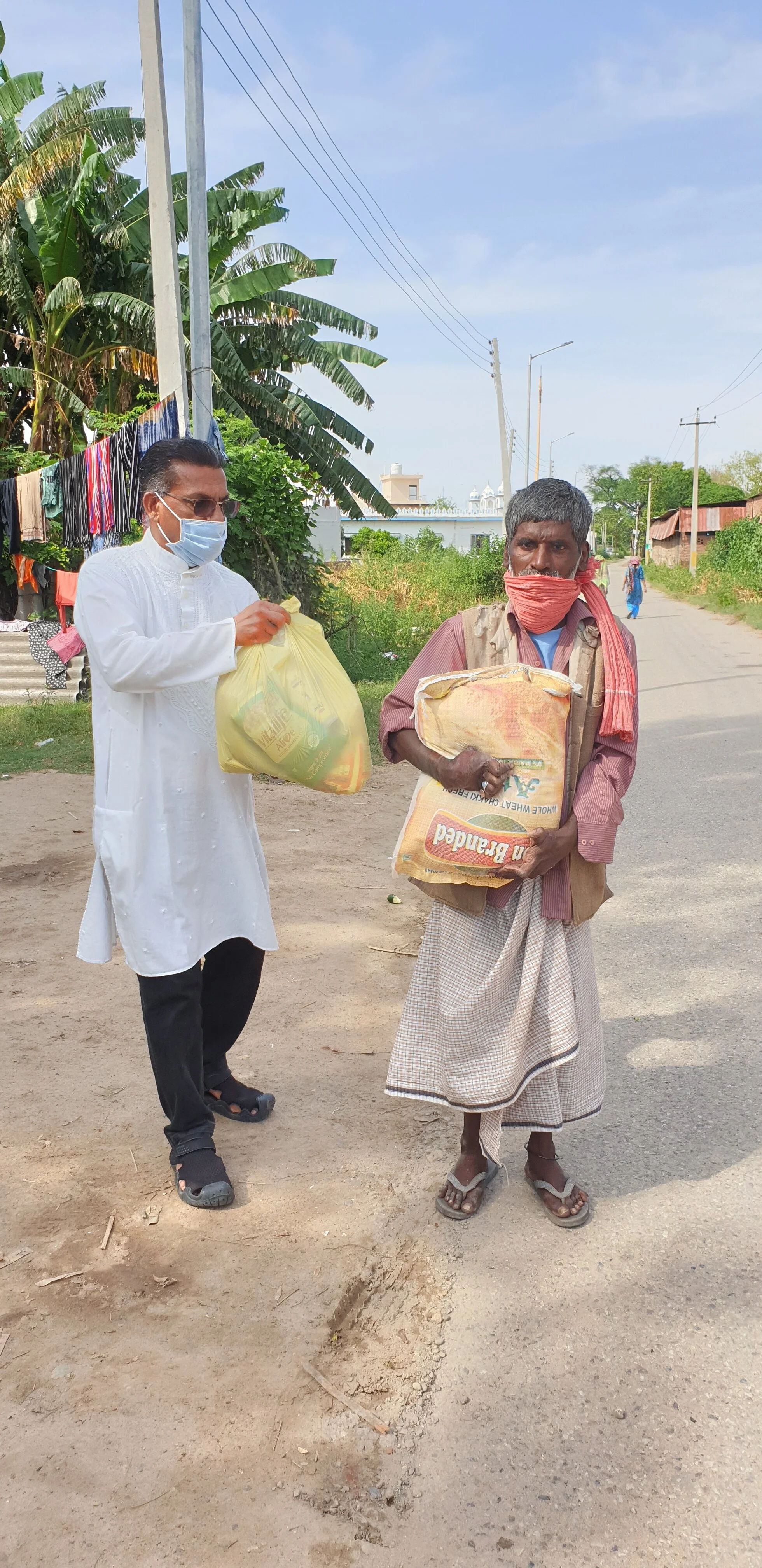 Distributing groceries among slums during the Covid-19 lockdown period in Punjab.