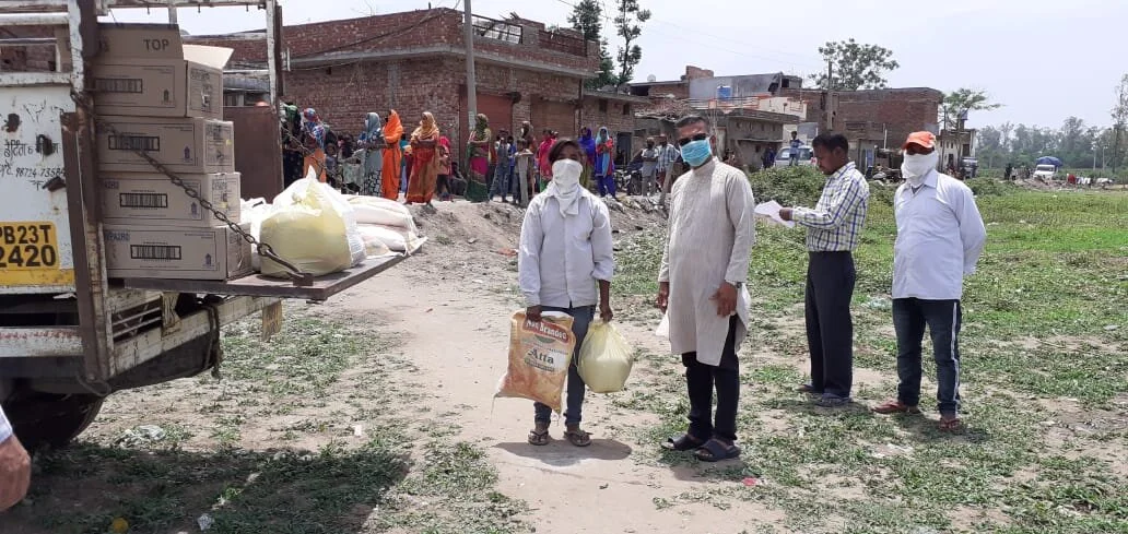 Distributing groceries among migrant daily-wage labourers during the Covid-19 lockdown period in Punjab.