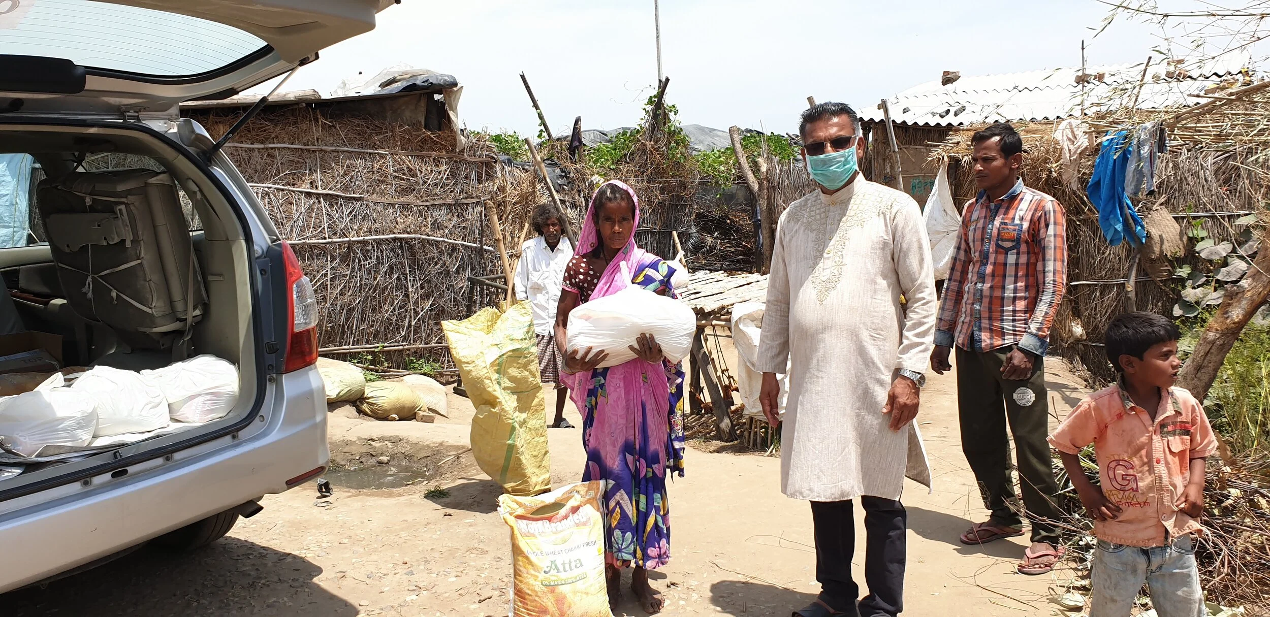 Distributing groceries among slums during the Covid-19 lockdown period in Punjab.