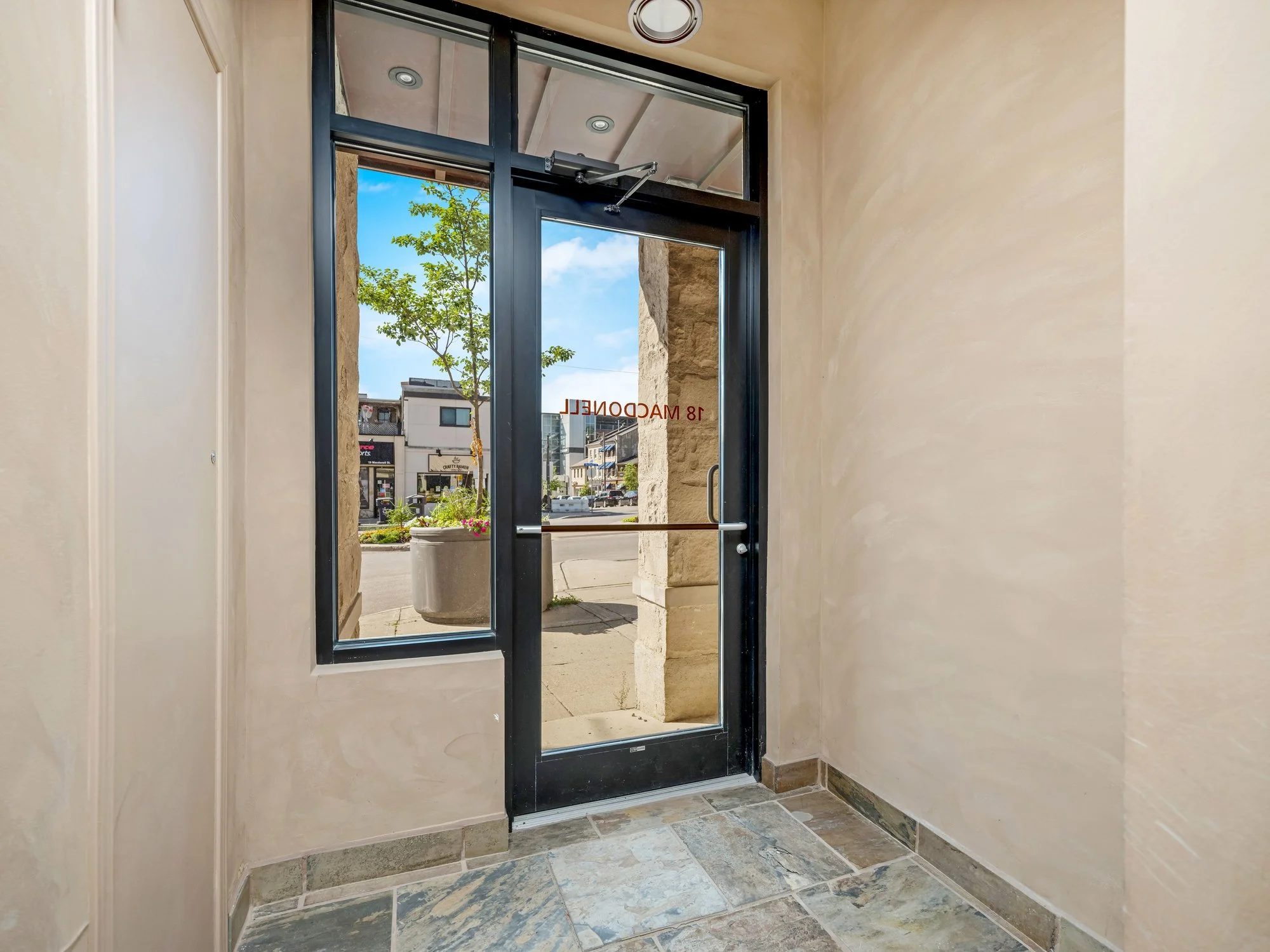 Glass entrance door and vestibule inside 18 Macdonell Street