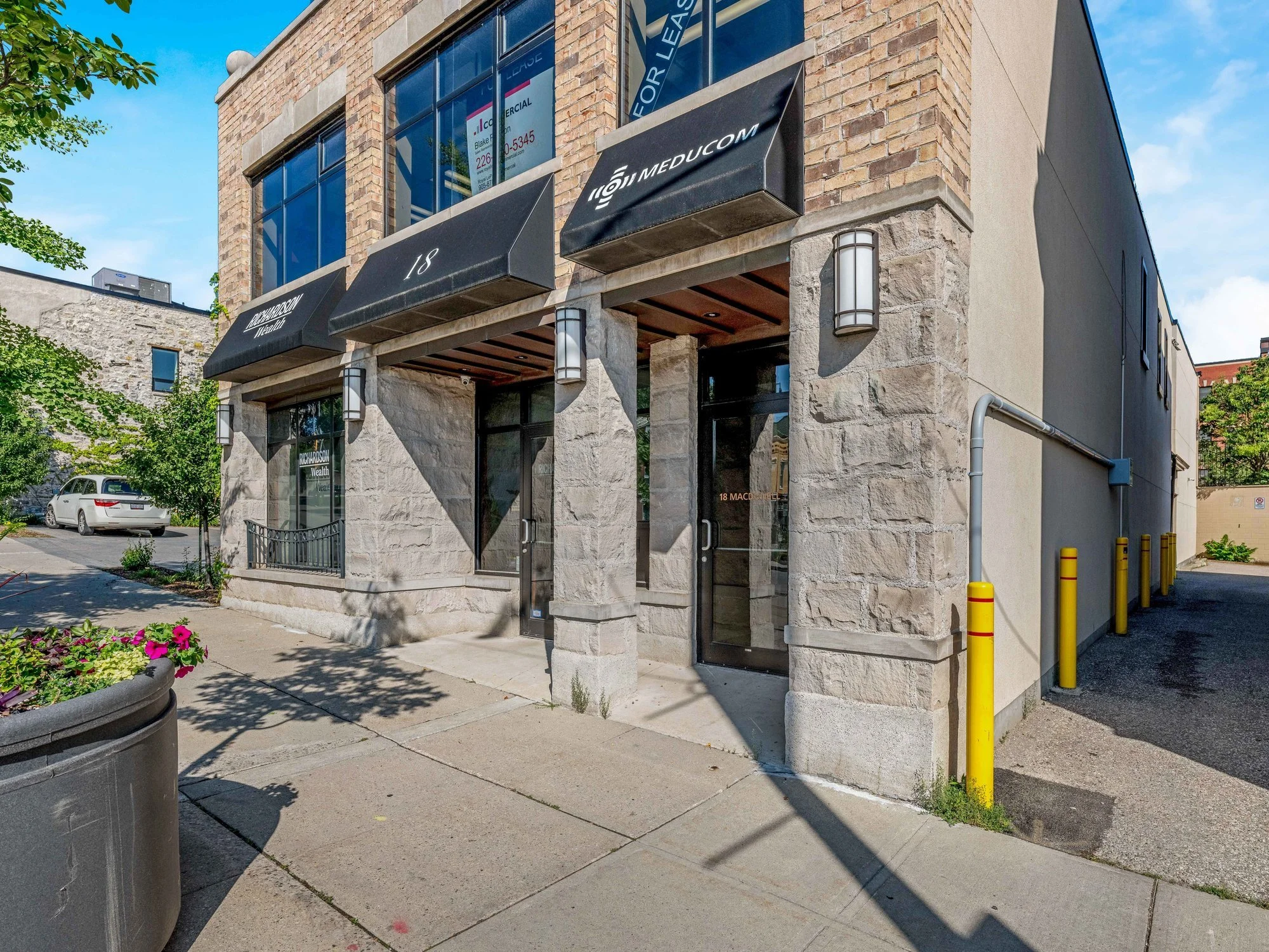 Side view of the 18 Macdonell Street entrance with stone pilaster and awnings