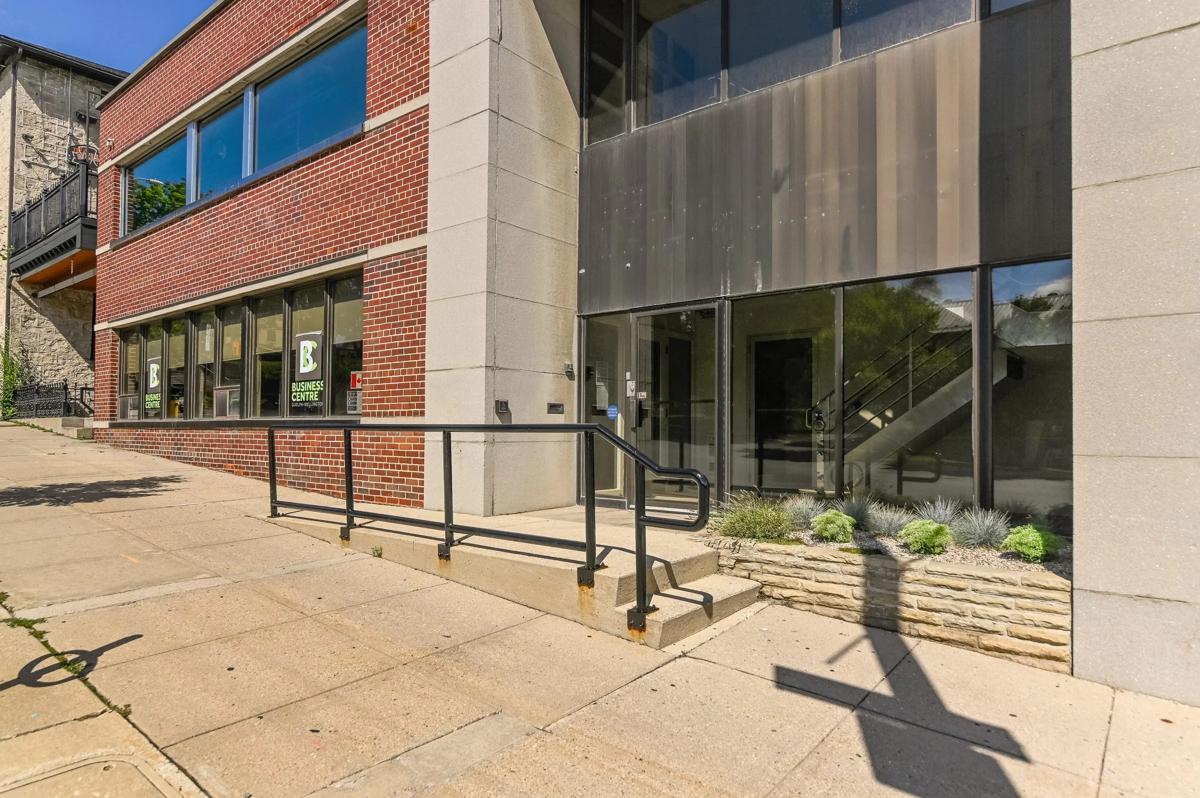 Close view of the building entrance and brick facade at 8 Macdonell Street