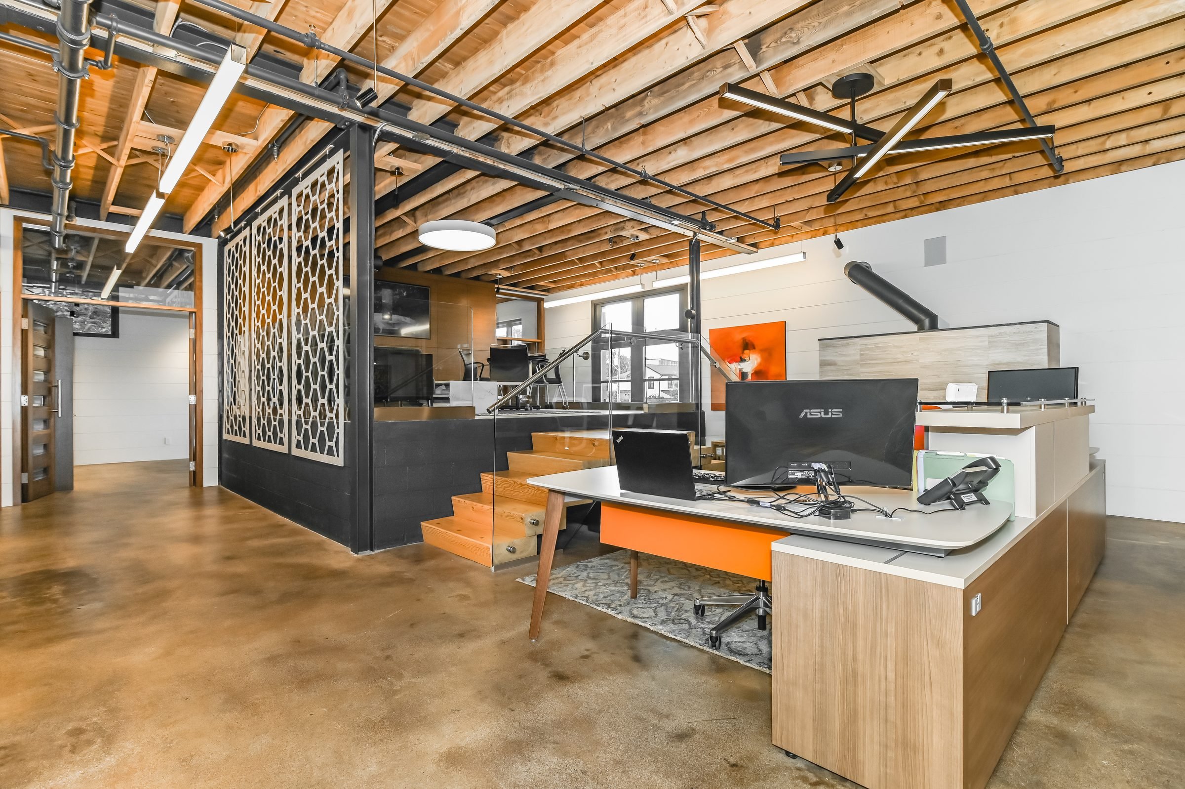 Built-in workstations under exposed wood ceiling joists, Unit 200, 13 Cork Street East