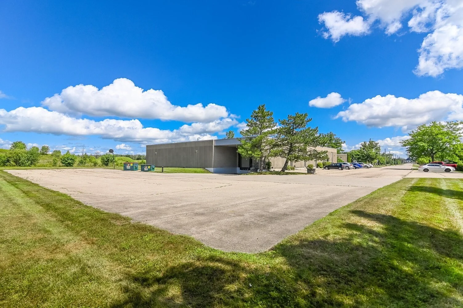 Wide paved parking area at 546 Governors Road with the building in the distance