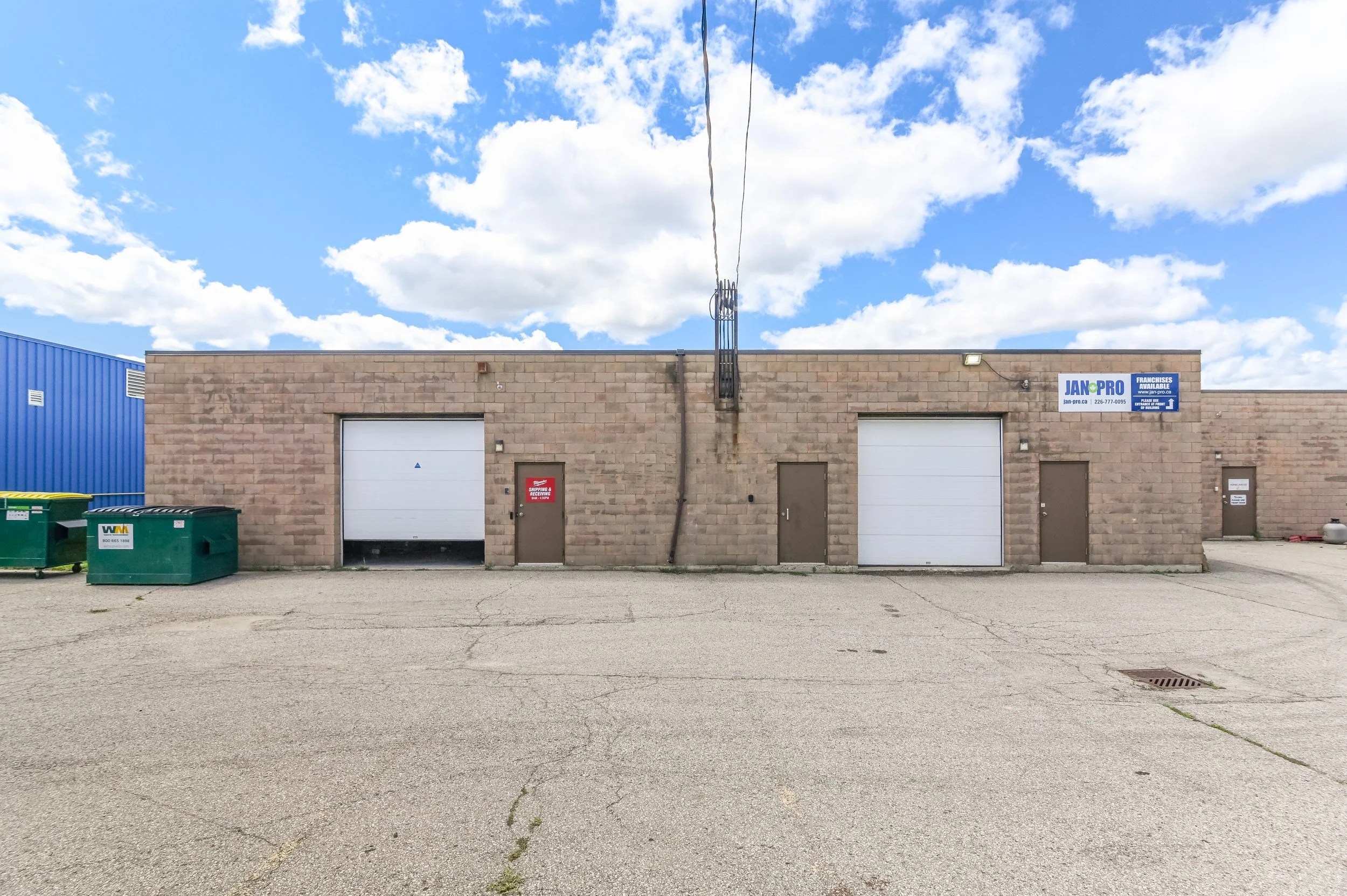 Industrial units with two white overhead doors at 335 Sovereign Road