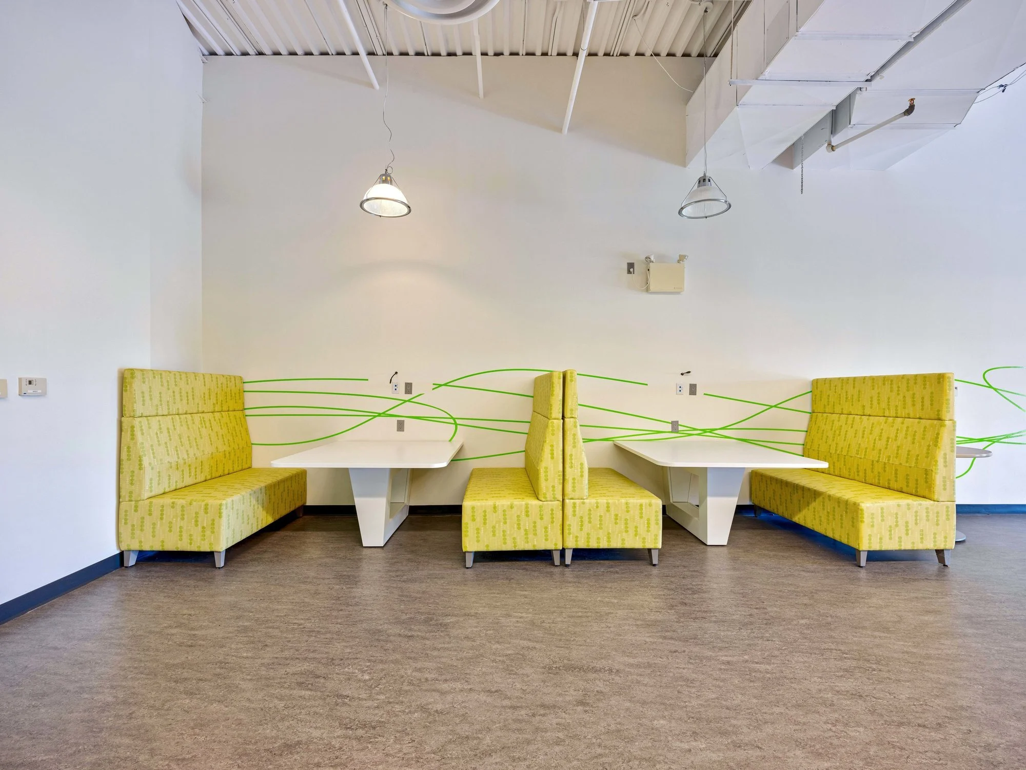 Yellow booth seating in the cafeteria lounge