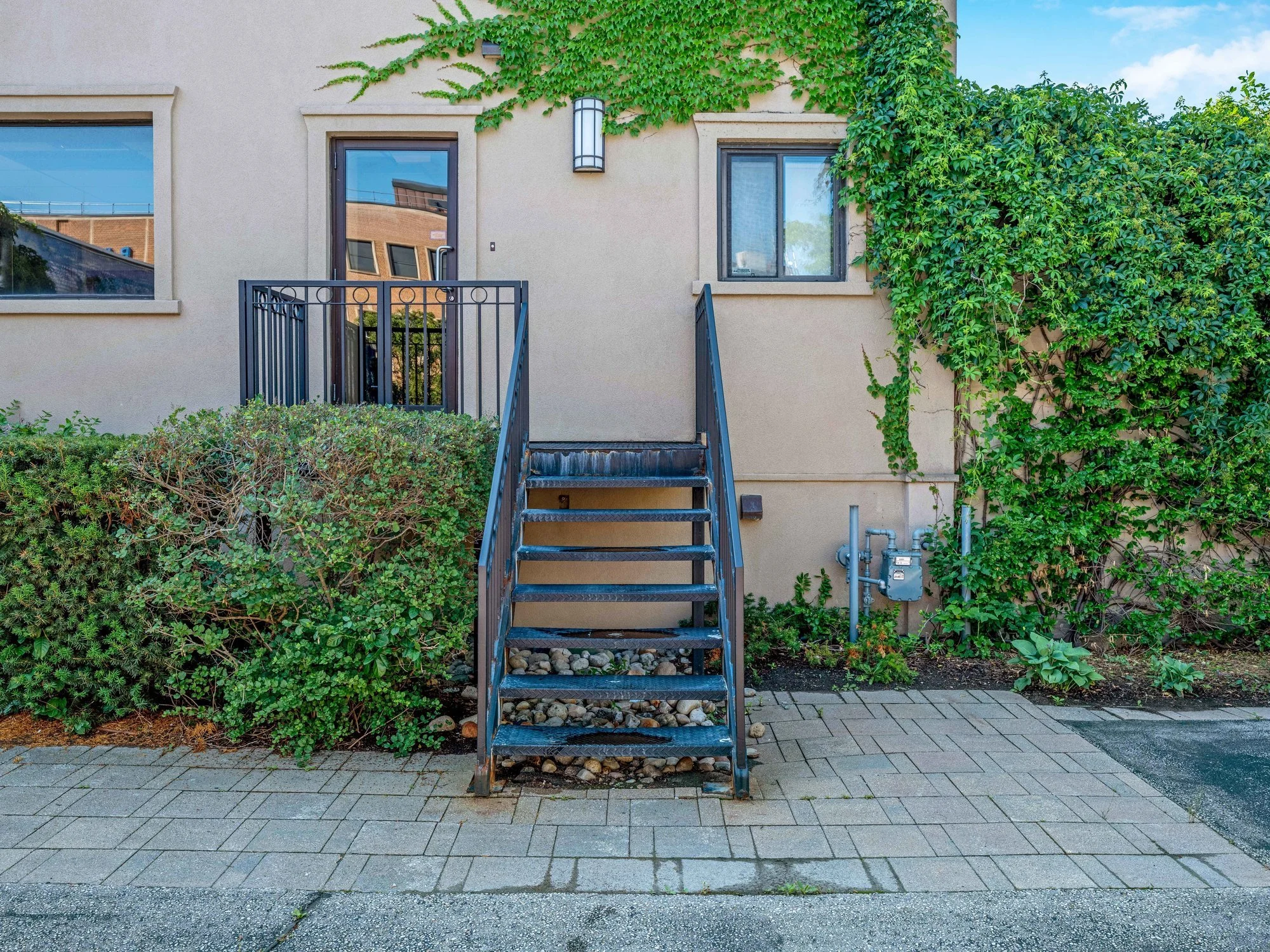 Rear courtyard with metal exterior stairs