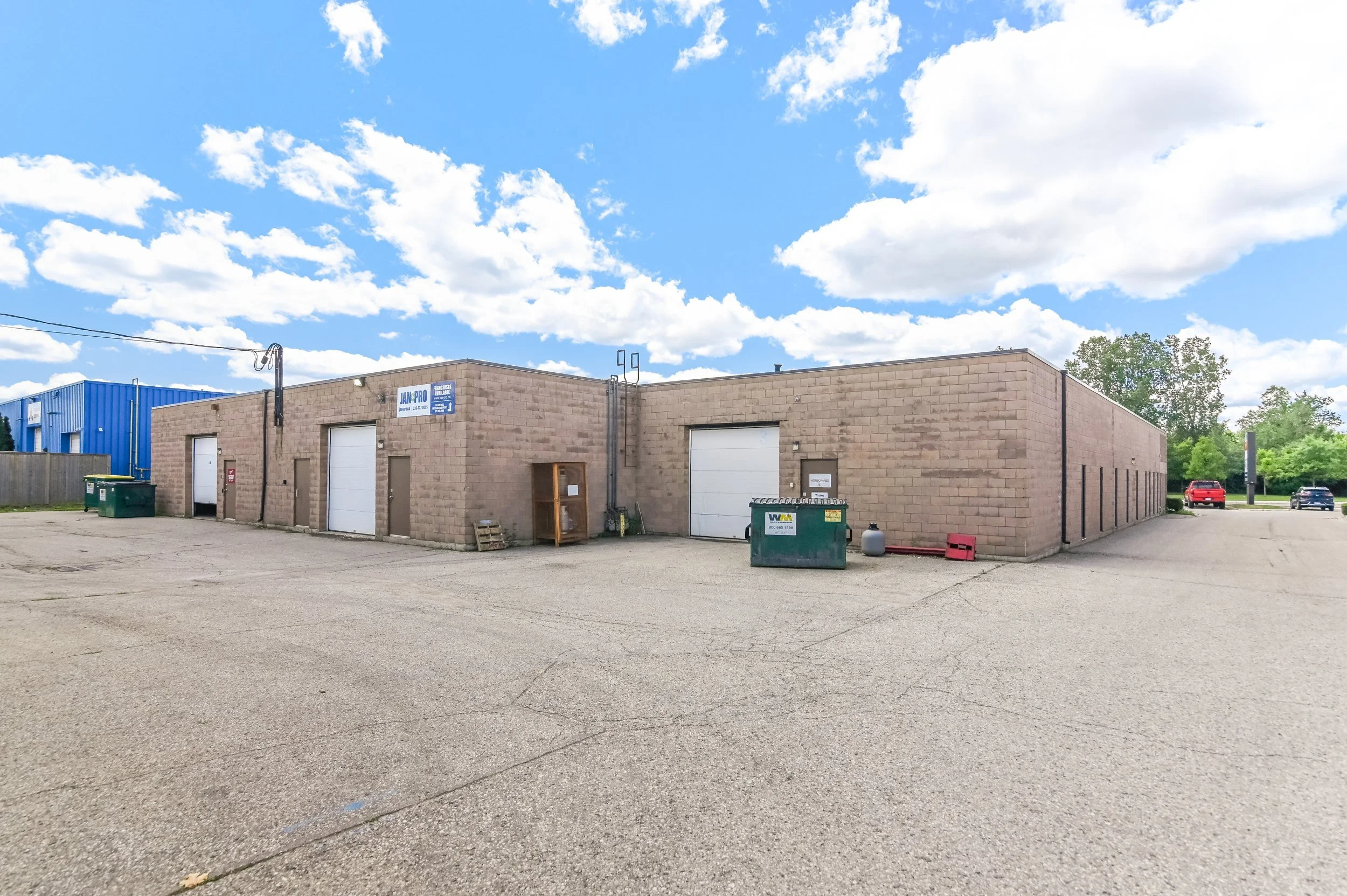 Row of industrial units with overhead doors at 335 Sovereign Road