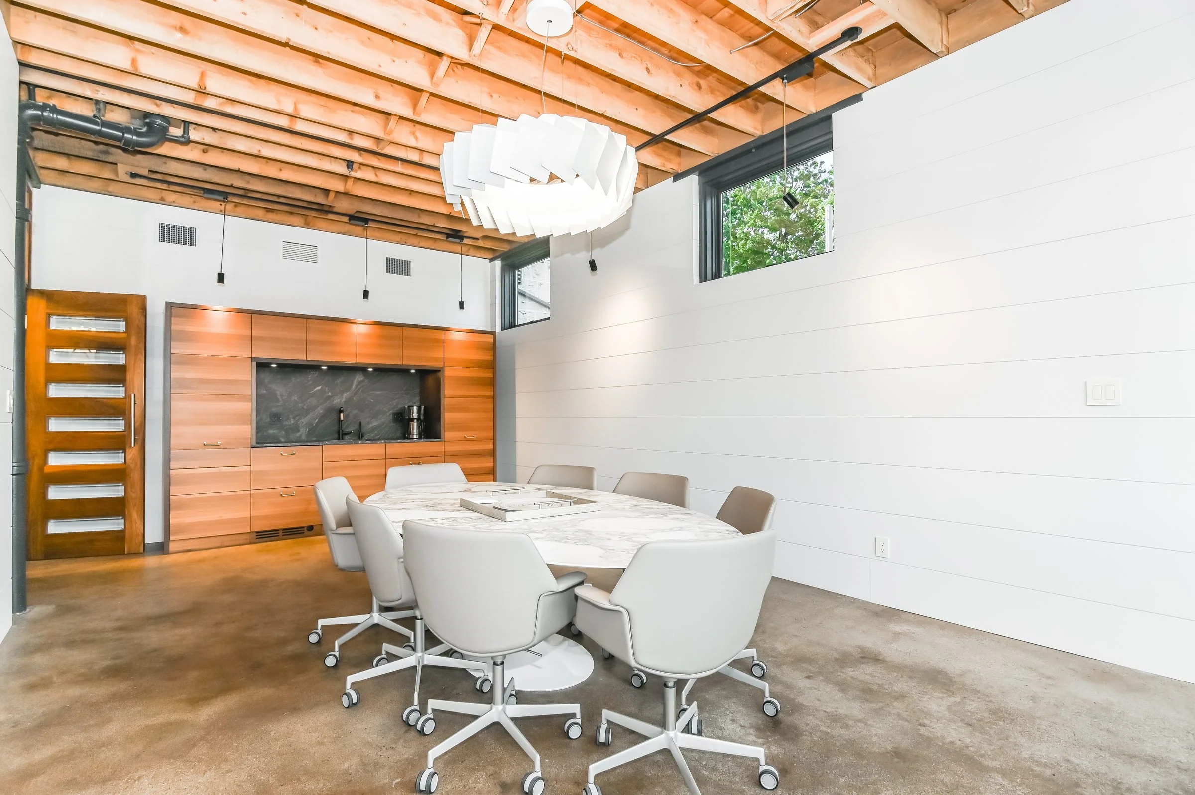 Boardroom with round table and white chairs, Unit 200, 13 Cork Street East