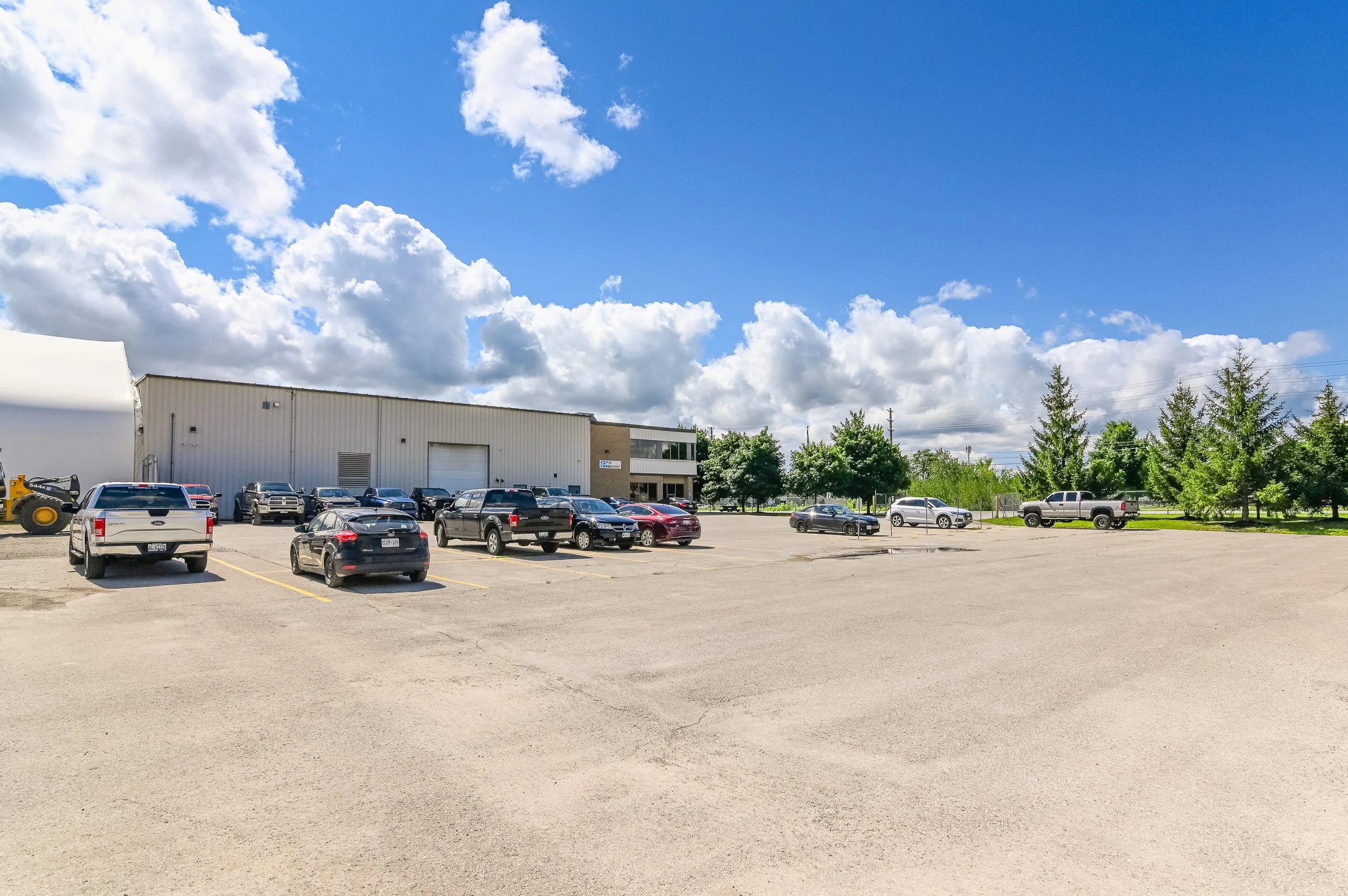 Building frontage at 455 Silvercreek Parkway North with parked vehicles