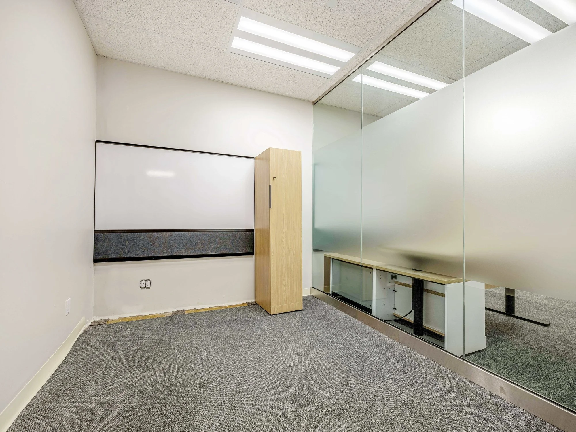 Private office with a whiteboard, storage cabinet and frosted glass wall at 8 Macdonell Street, Unit 200A, Guelph