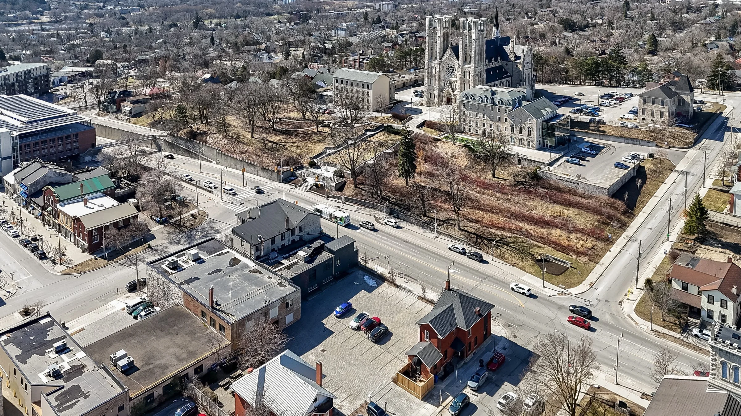 Aerial view of downtown Guelph blocks and the cathedral from above a main street
