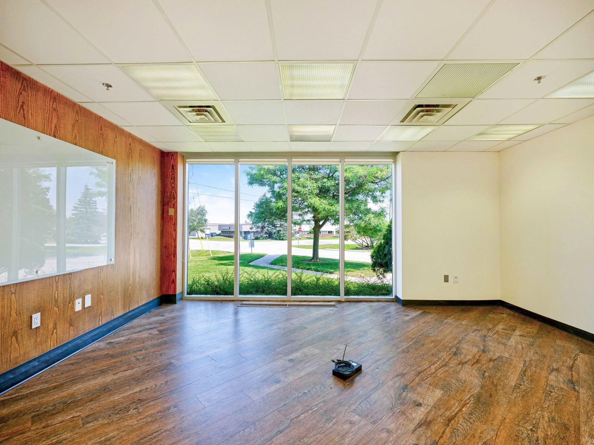 Meeting room with wood panelling and large windows