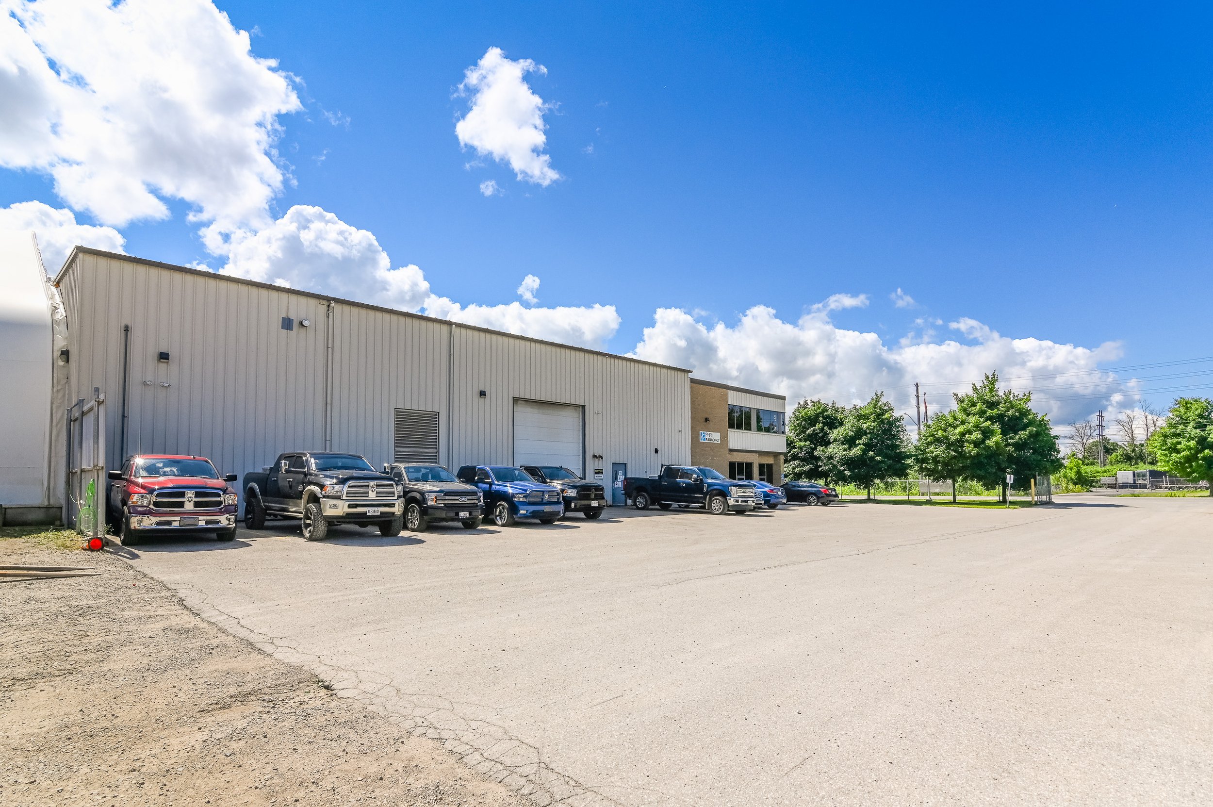 Building and parking lot at 455 Silvercreek Parkway North seen from the yard
