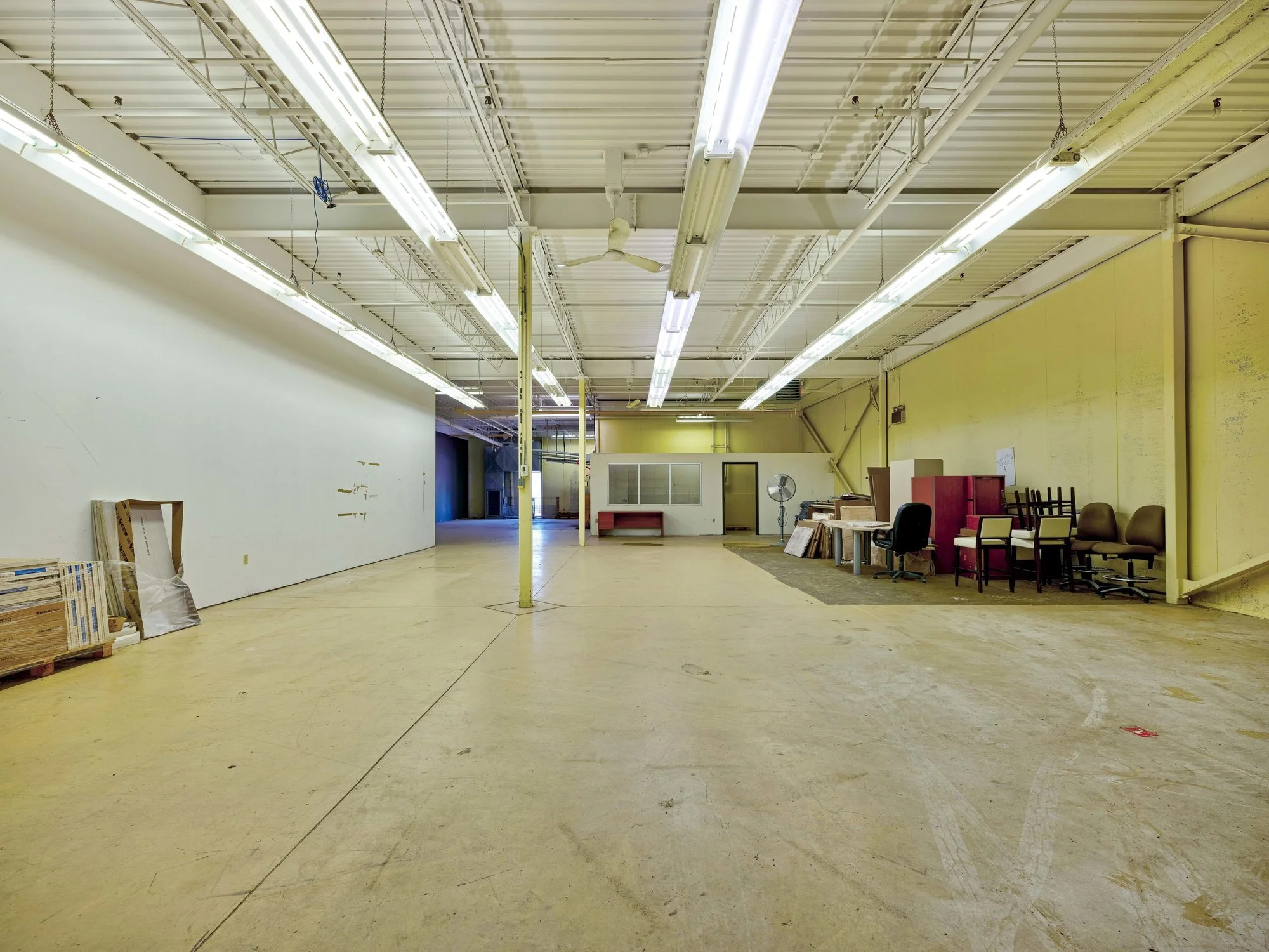 Warehouse interior with high ceiling and open floor