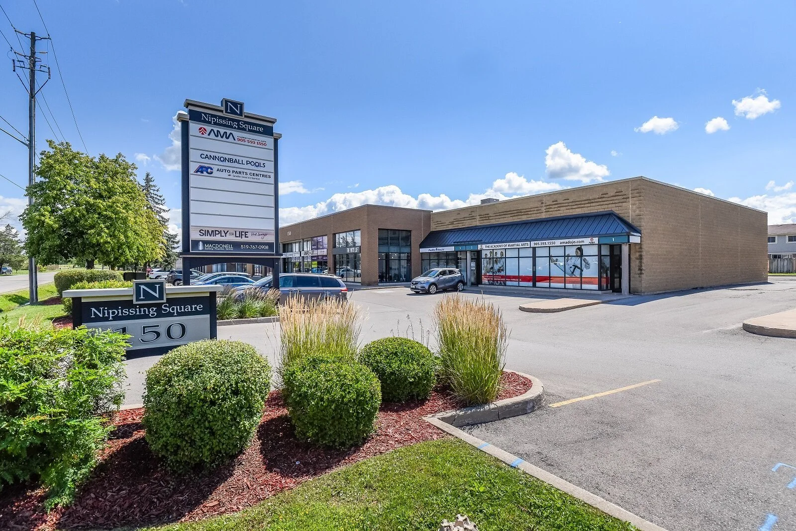 Plaza sign and storefronts at 150 Nipissing Road in Nipissing Square, Milton