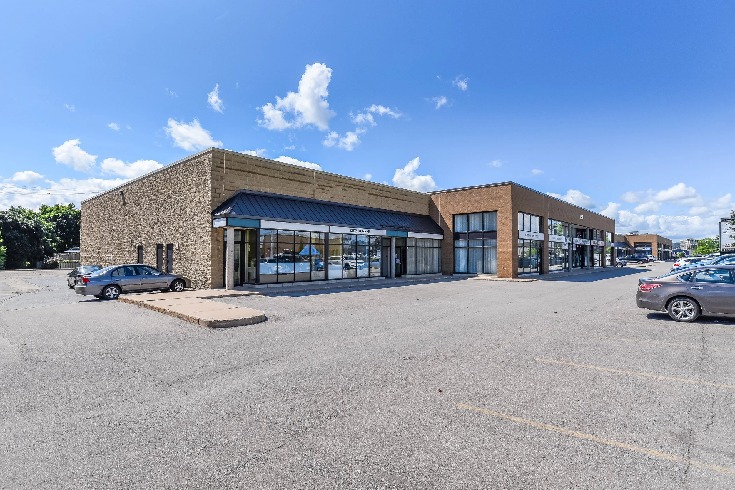 Storefronts beside the parking lot at Nipissing Square, 150 Nipissing Road, Milton