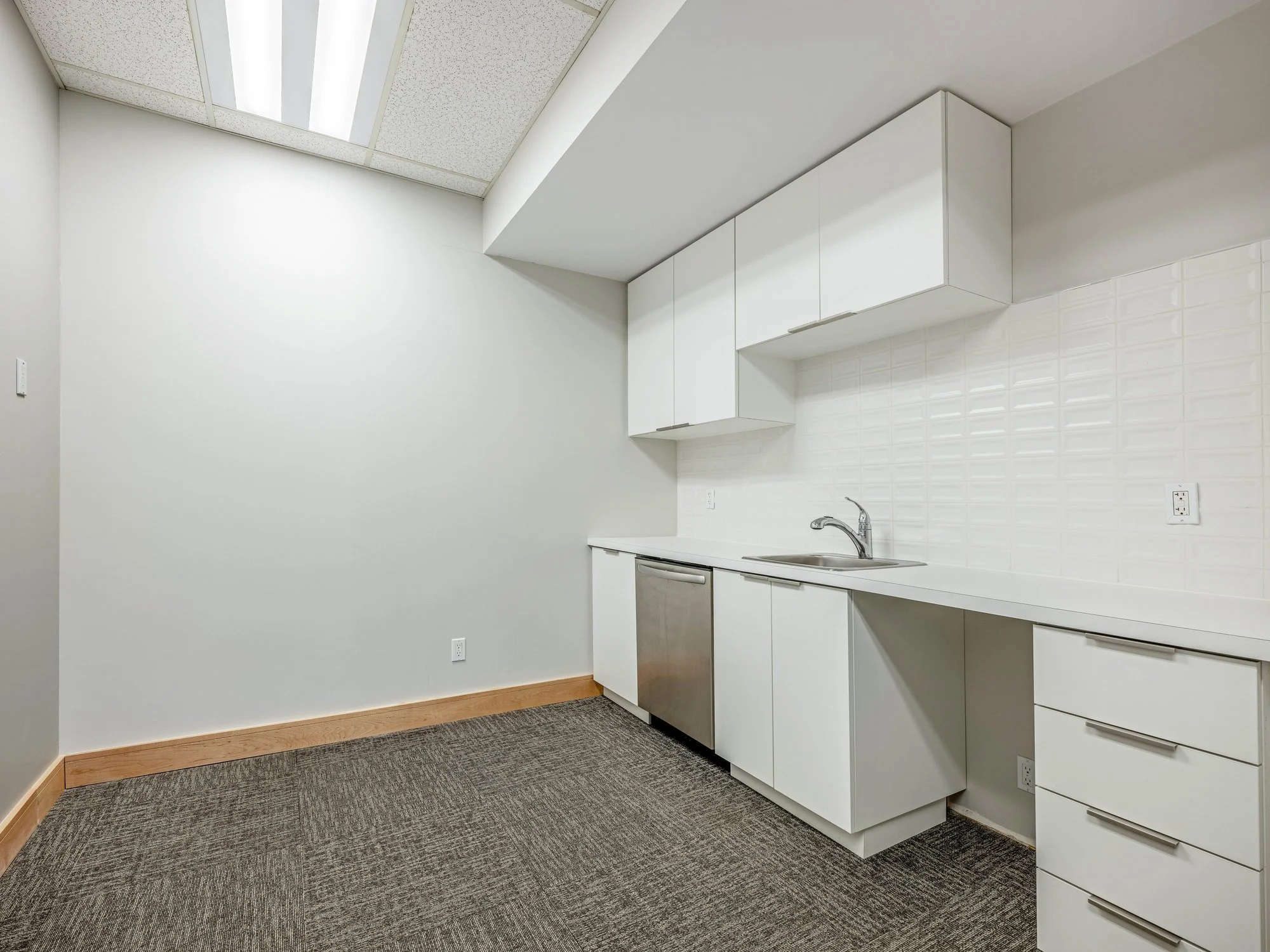 Kitchenette with white cabinetry and counter space at 8 Macdonell Street, Unit 200A, Guelph