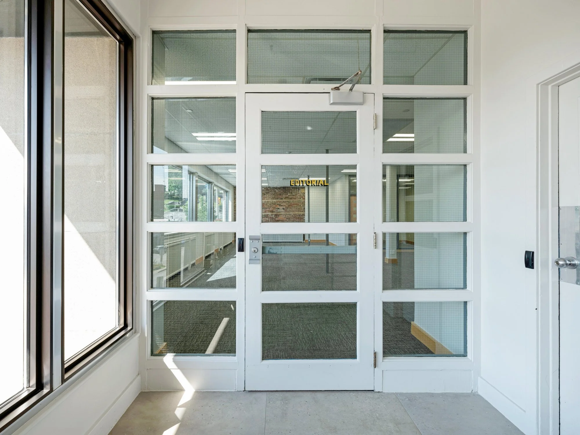Glass entry doors into Unit 200A at 8 Macdonell Street, Guelph
