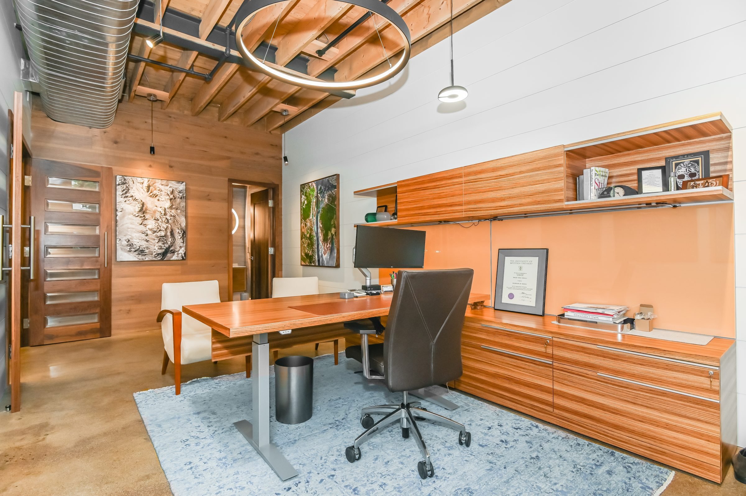 Private office with wood desk and built-in shelving, Unit 200, 13 Cork Street East