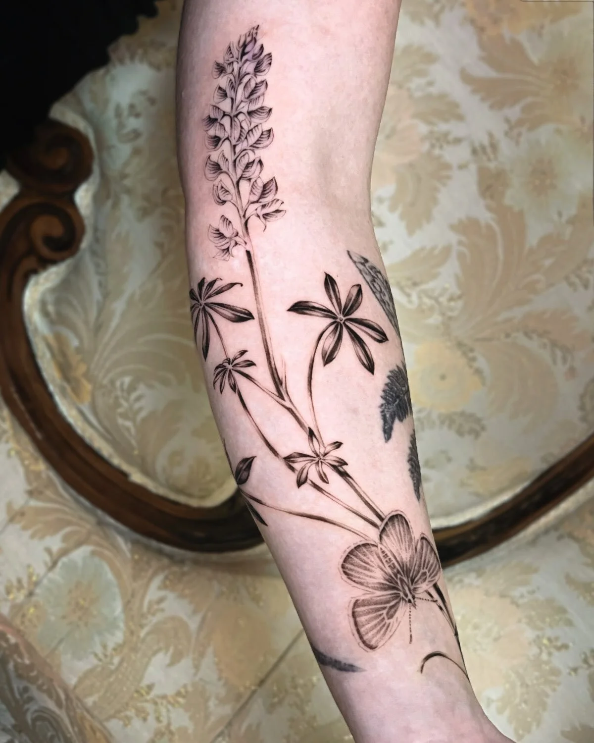 a California lupine &amp; fluttering mission blue 🖤 a wrapping and flourishing Californian sleeve soon to be consumed by the redwood forest floor&hellip;. More to come!! Thank you so much Milo for this beautiful &amp; ongoing project 🌿

#lupinetatt