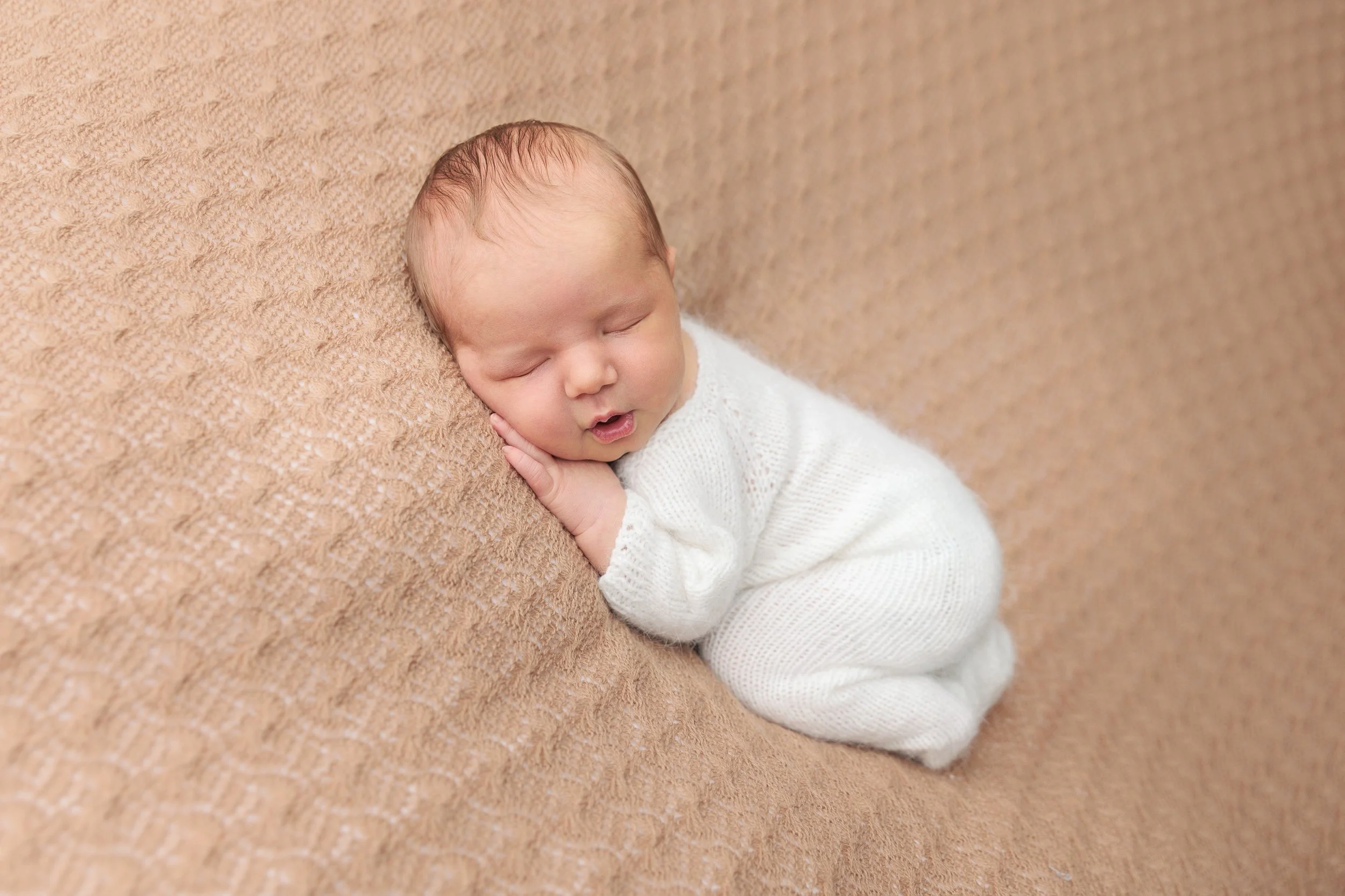 sleepy newborn baby studio session