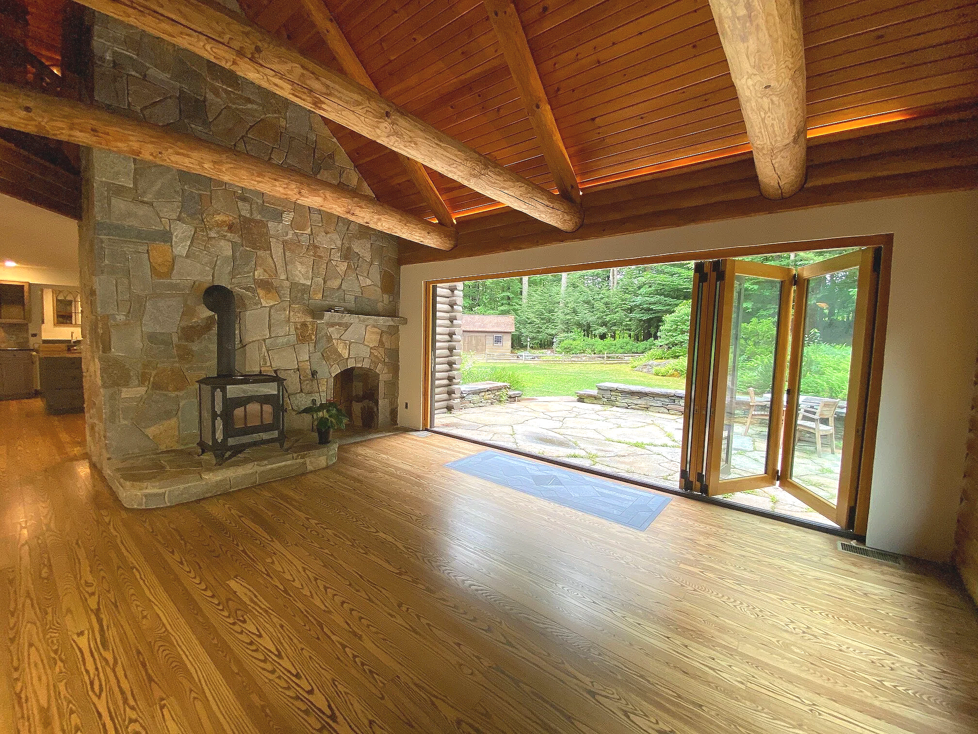 AFTER- Living Room Bi-Fold Door almost fully open! Looking out to the patio.