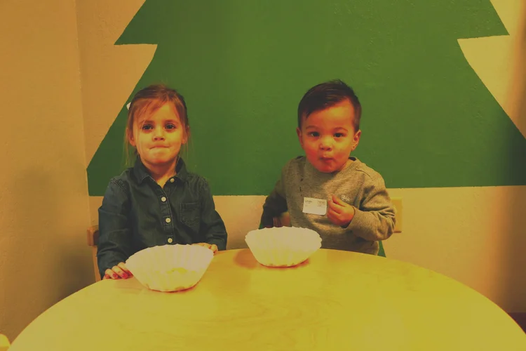 Two preschool children enjoying an activity at New Horizons Kids