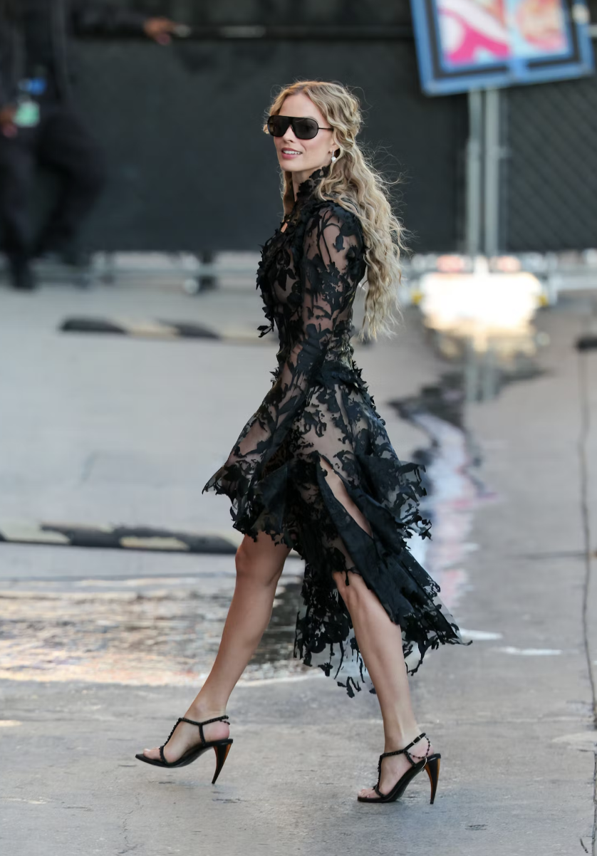  Heading into  Jimmy Kimmel Live , Robbie floats in a ghostly Alexander McQueen lace dress  Photo via Getty Images 