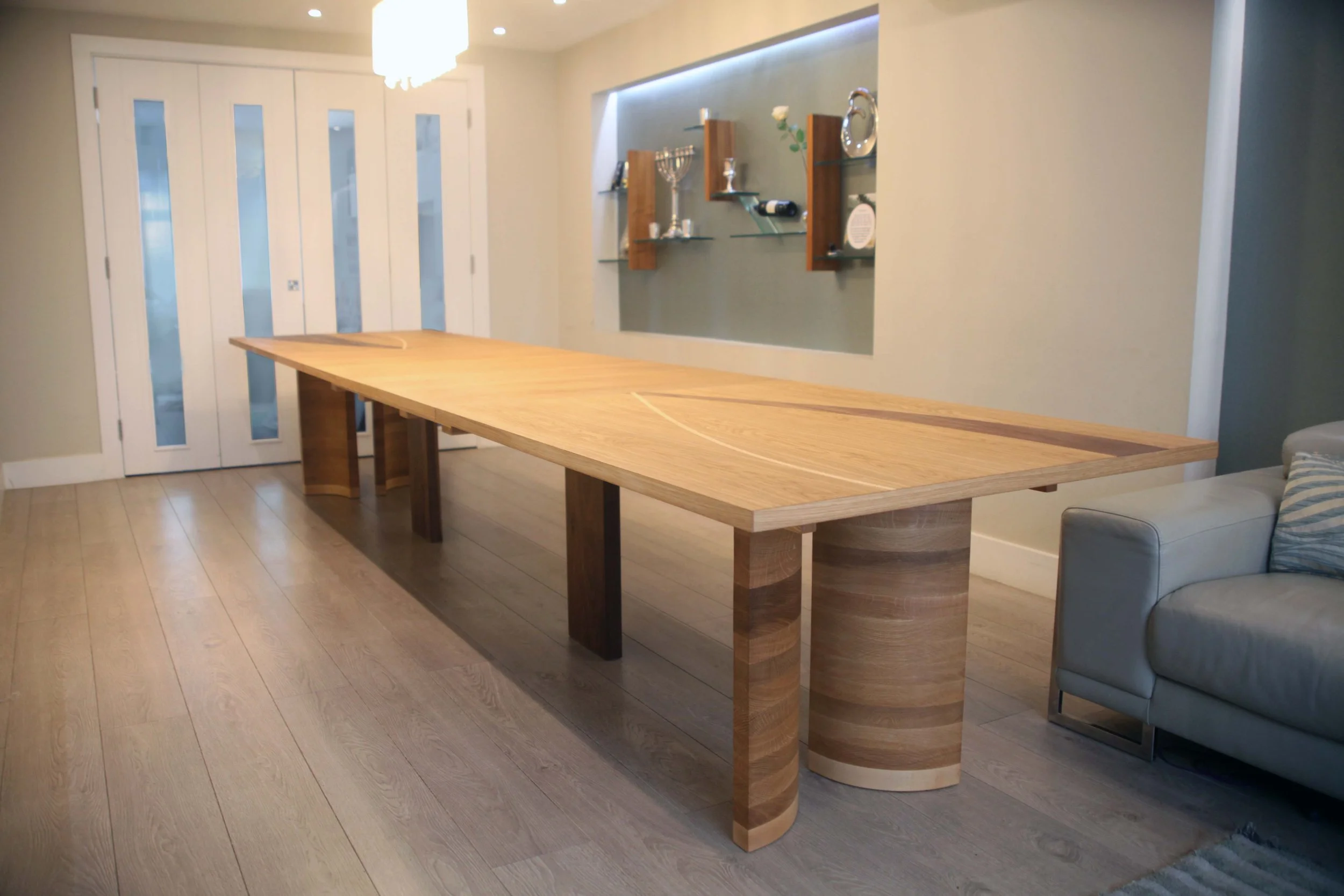Korman dining table 8 - 22 seater table made from oak and walnut with maple details 