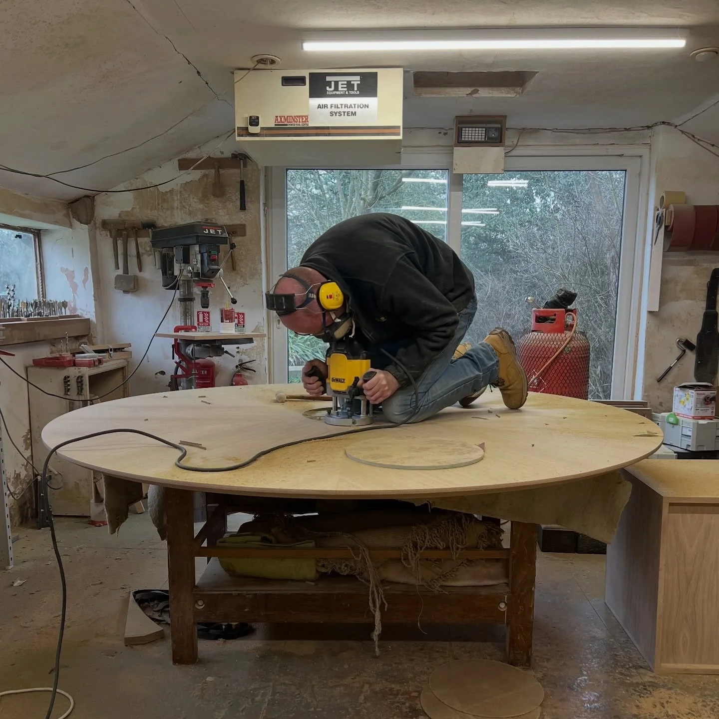 Whatever it takes to make a beautiful piece of furniture!! This round dining table is taking all the space in the workshop, and even with Nick&rsquo;s long arms we can&rsquo;t get to the centre of it to inlay the burr-oak centre piece! So on top of t