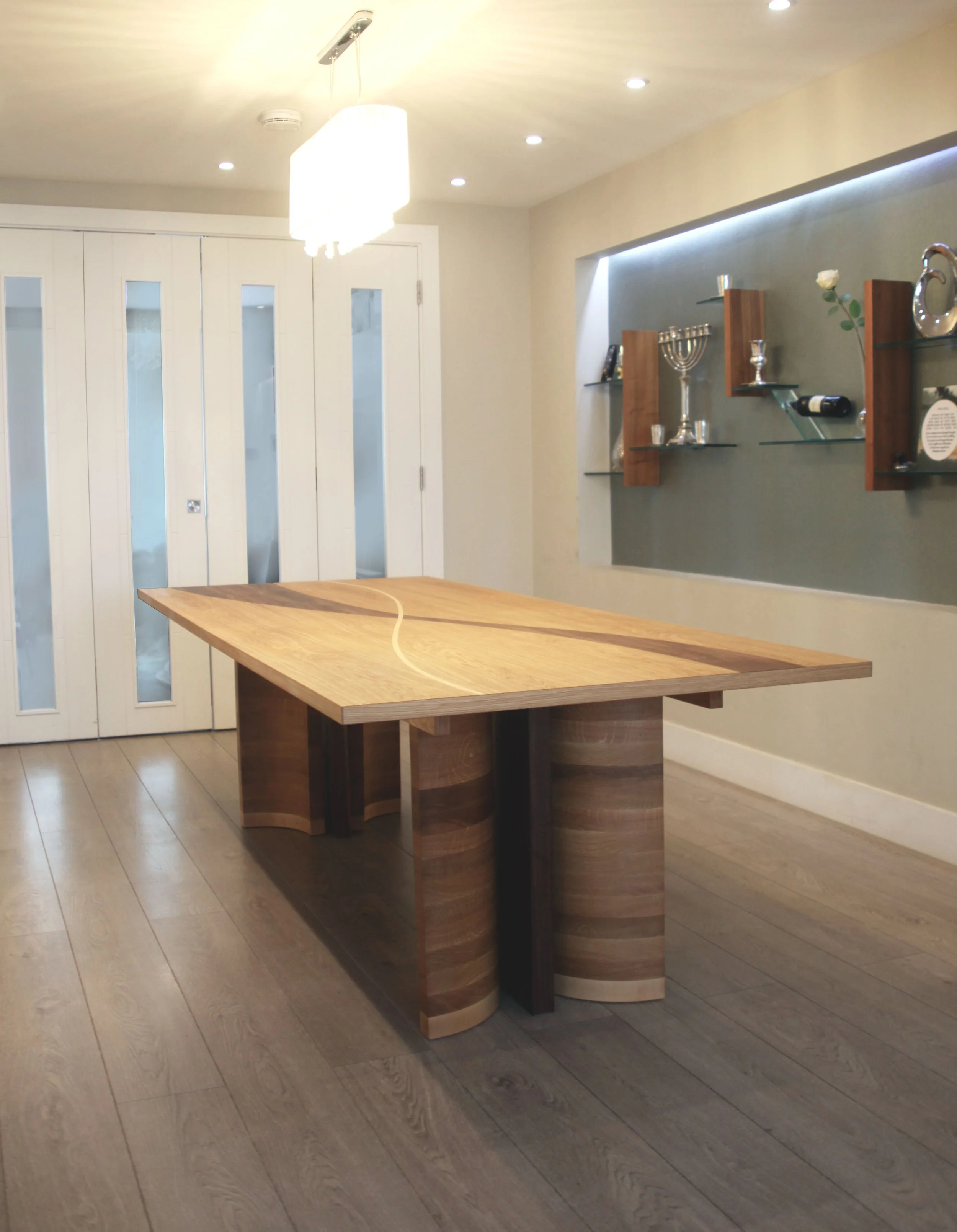 Korman dining table 8 - 22 seater table made from oak and walnut with maple details 