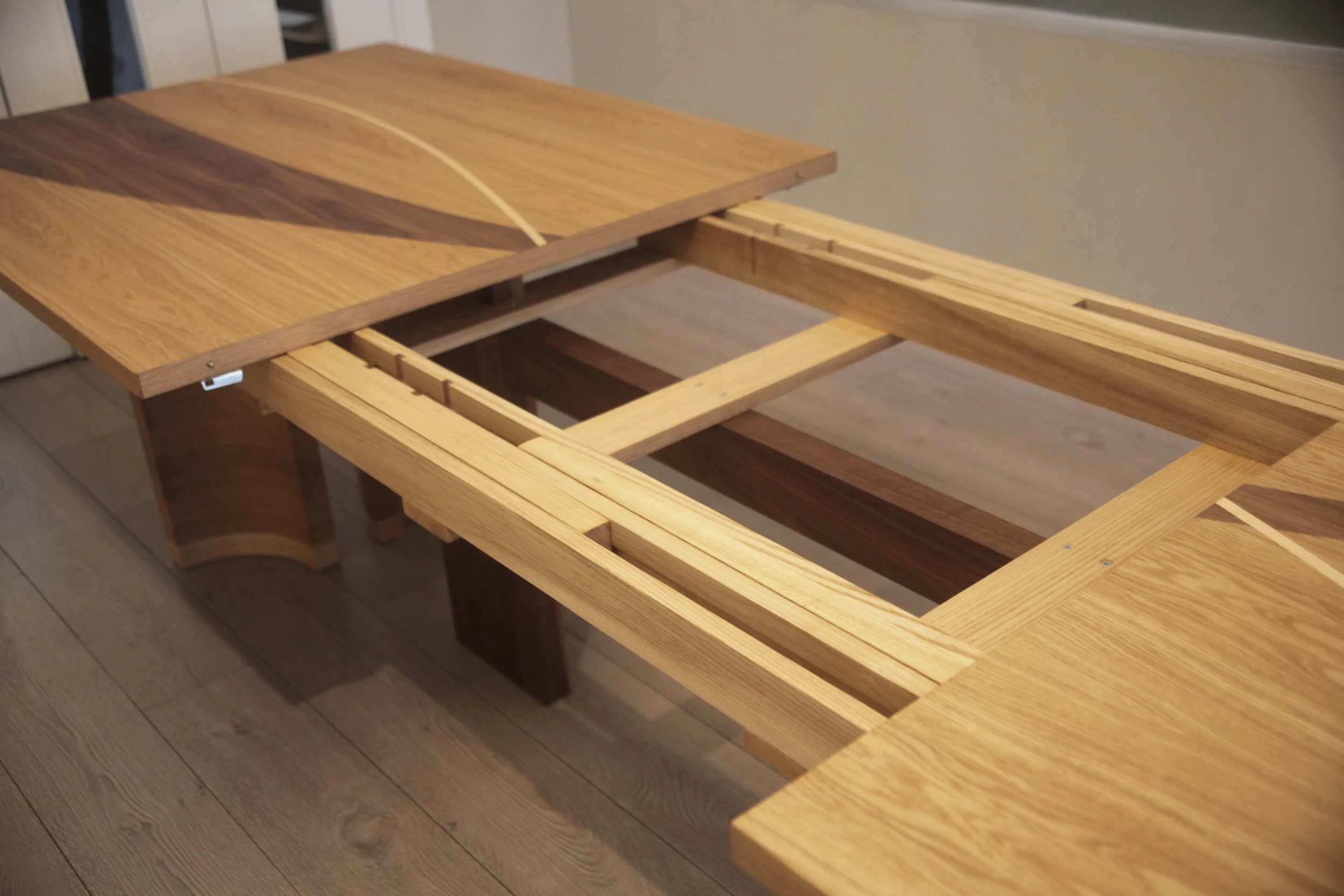 Korman dining table 8 - 22 seater table made from oak and walnut with maple details 