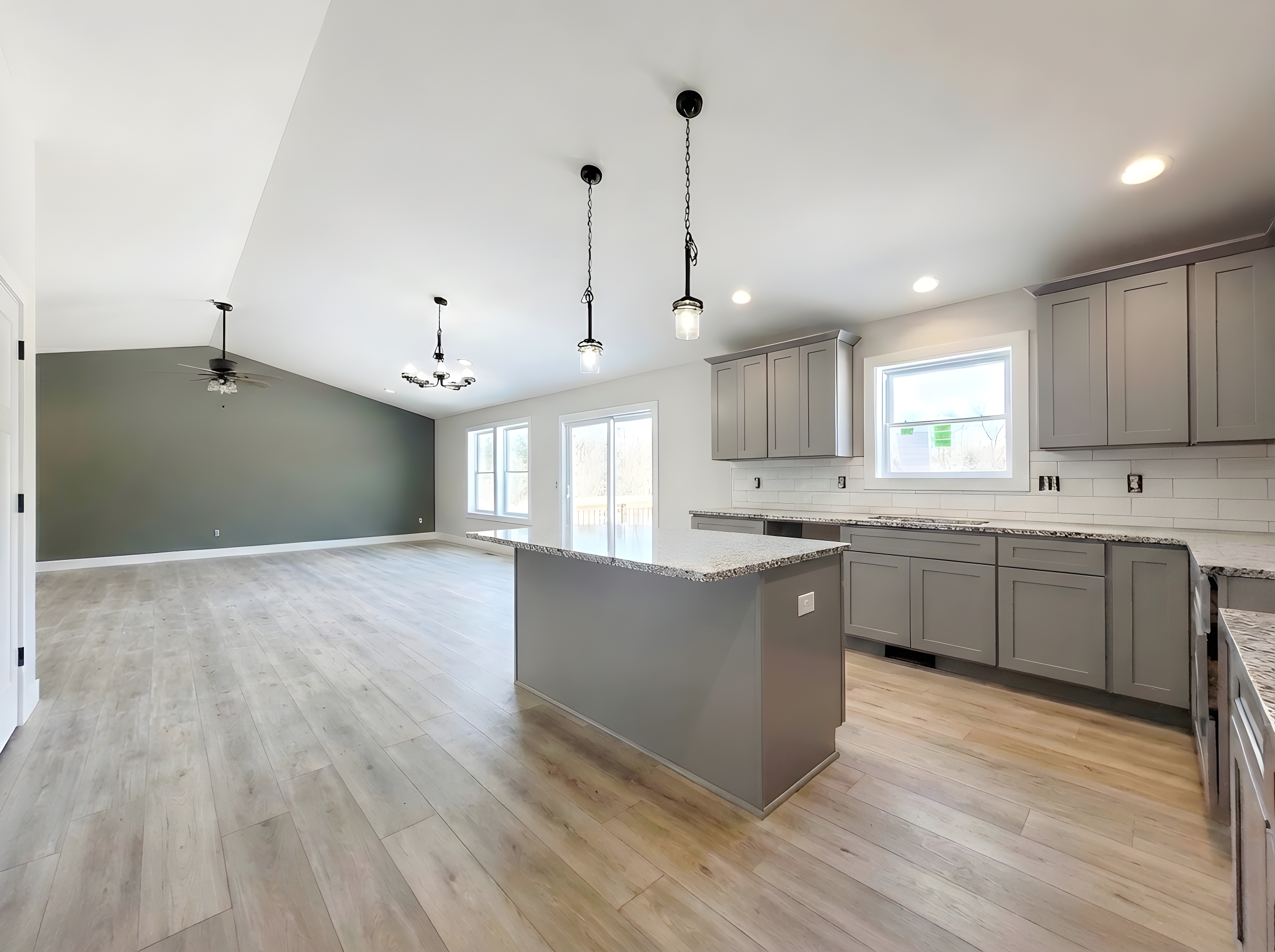 Open concept kitchen dining and living area in new construction home in Augusta MI.
