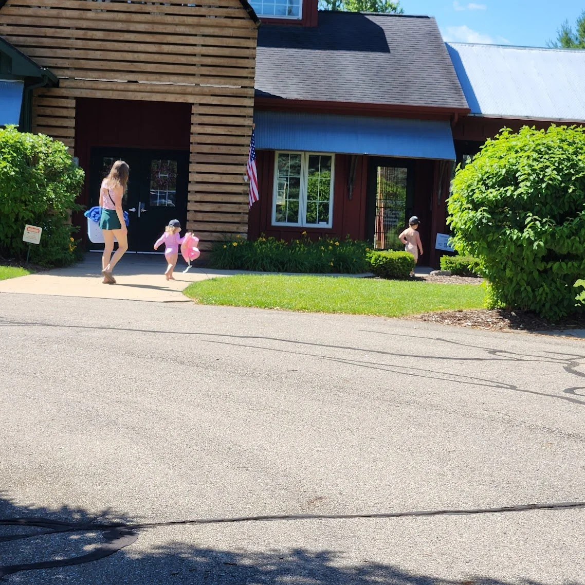 Young family heading for the swimming pool at Applegate.