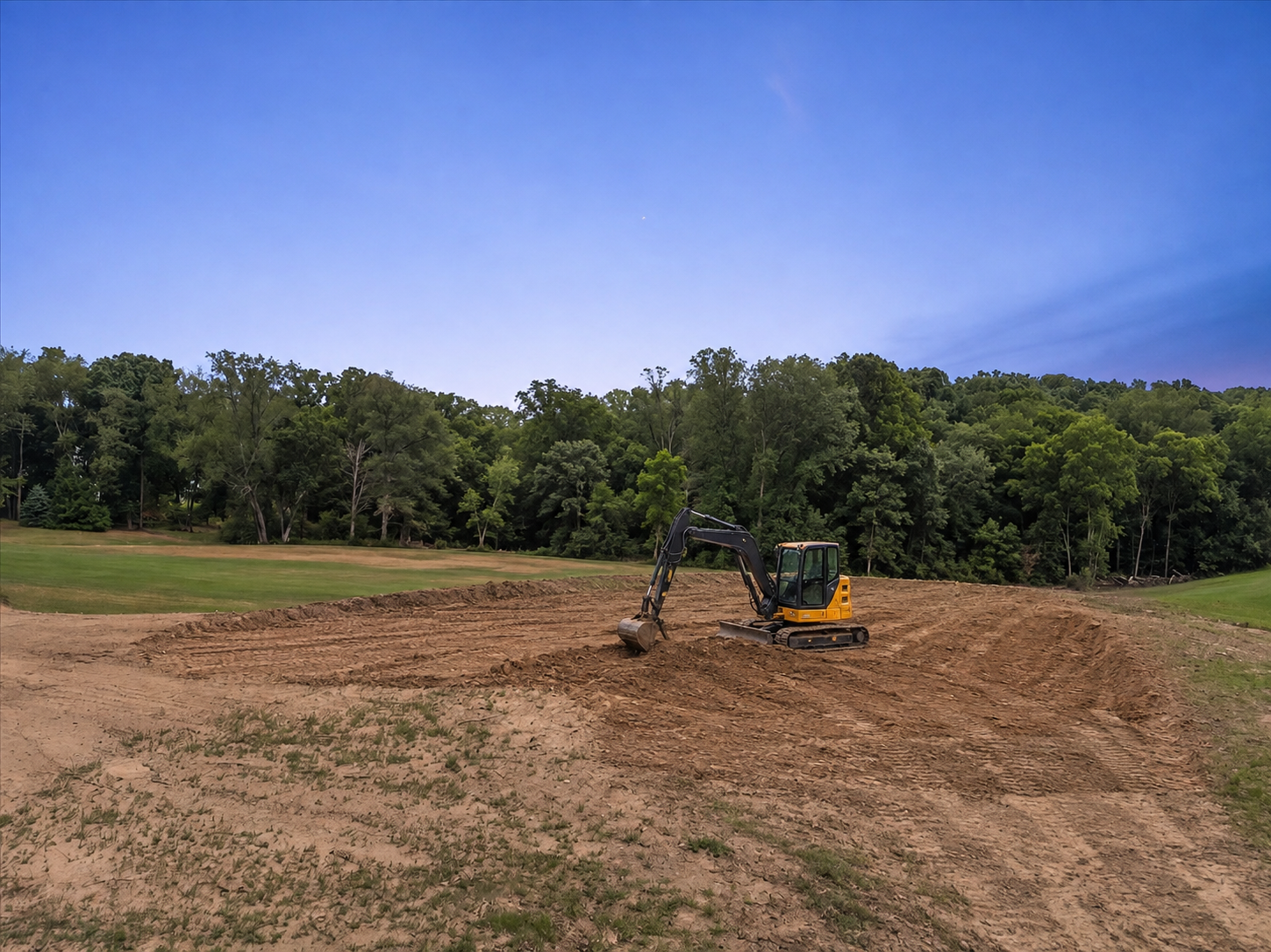 Picture of the digger and the vacant lot ready to build on the 17th green in Lake Doster