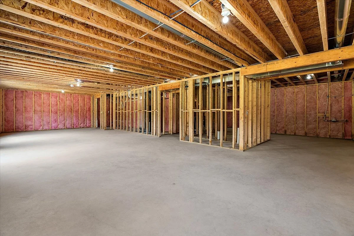 Picture of huge open space with framed in rooms and plumbing for a bath