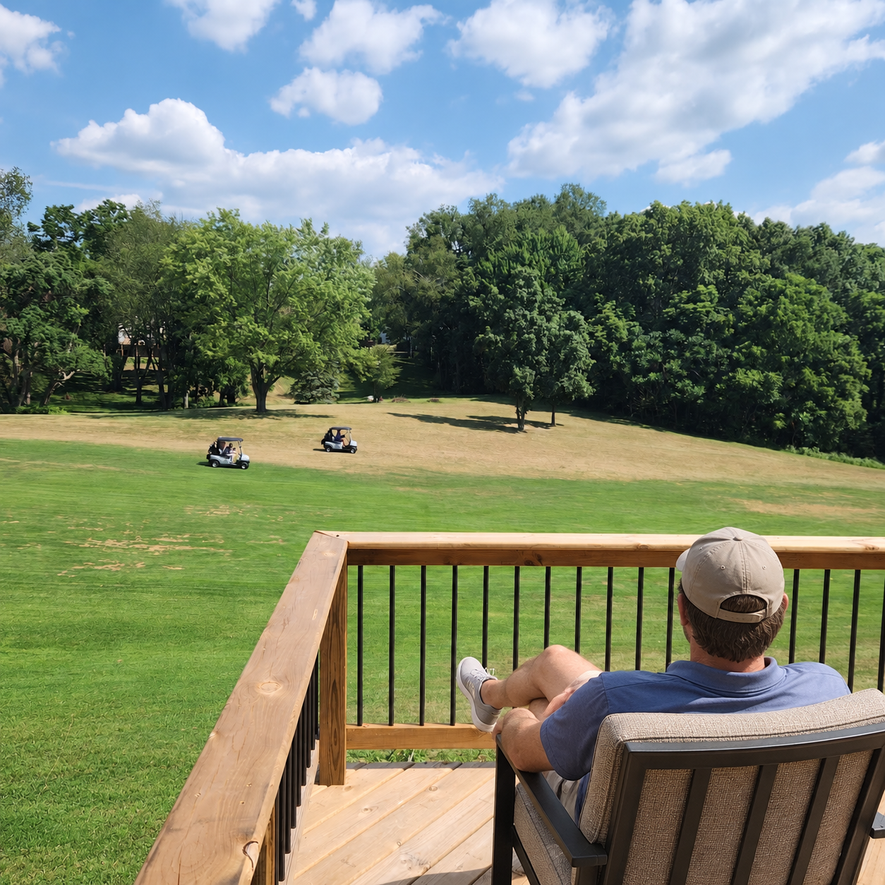 Man watching the golfers on the 17th green at Lake Doster Golf Course