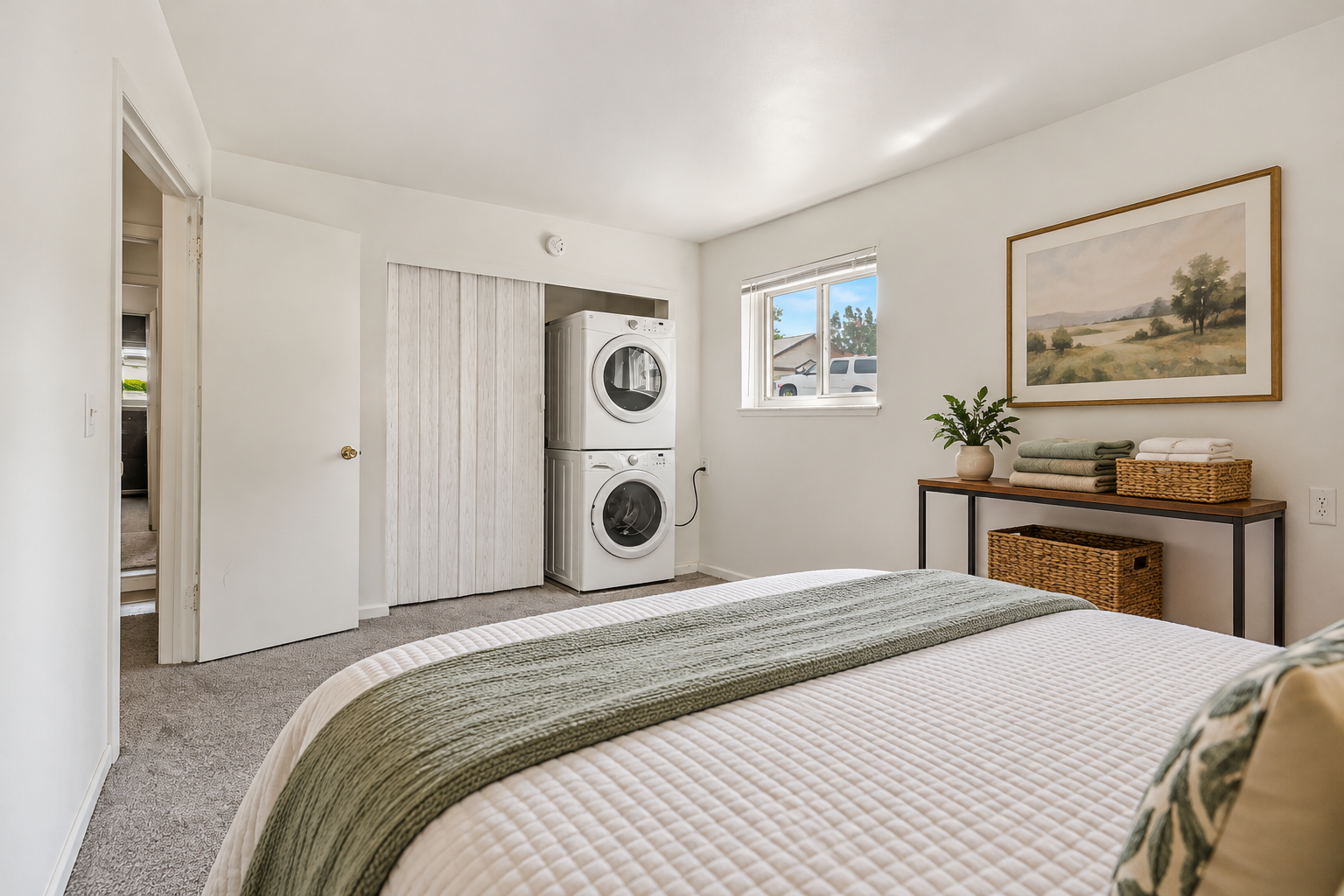 Image of a bedroom with the washer and dryer