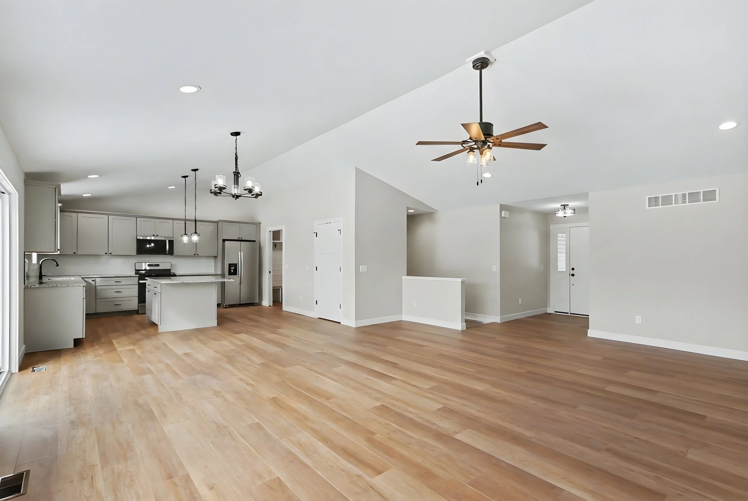 Unfurnished kichen and living room in the home for sale at 8663 Camomile, Augusta MI