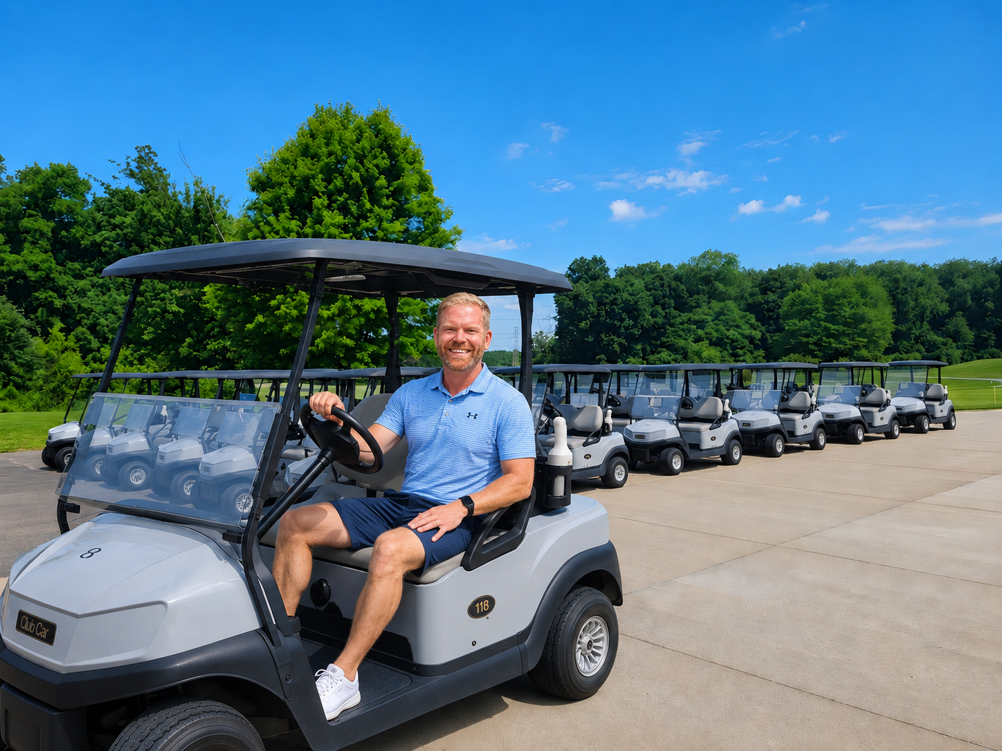 Jason Veenstra sitting in a golf cart at the Lake Doster Golf Course