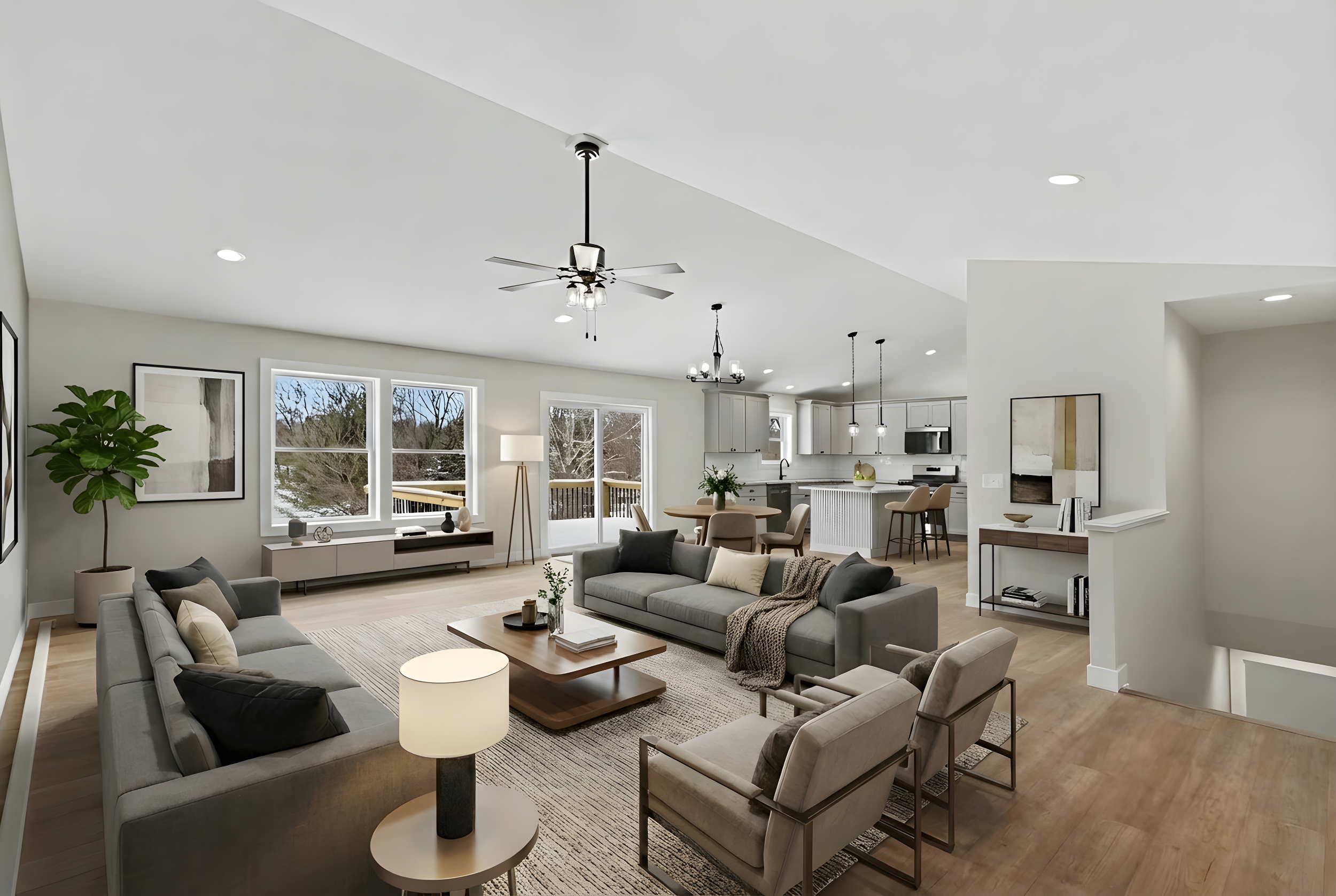 A virutally staged main floor at 8683 Camomile with living room, dining room and kitchen
