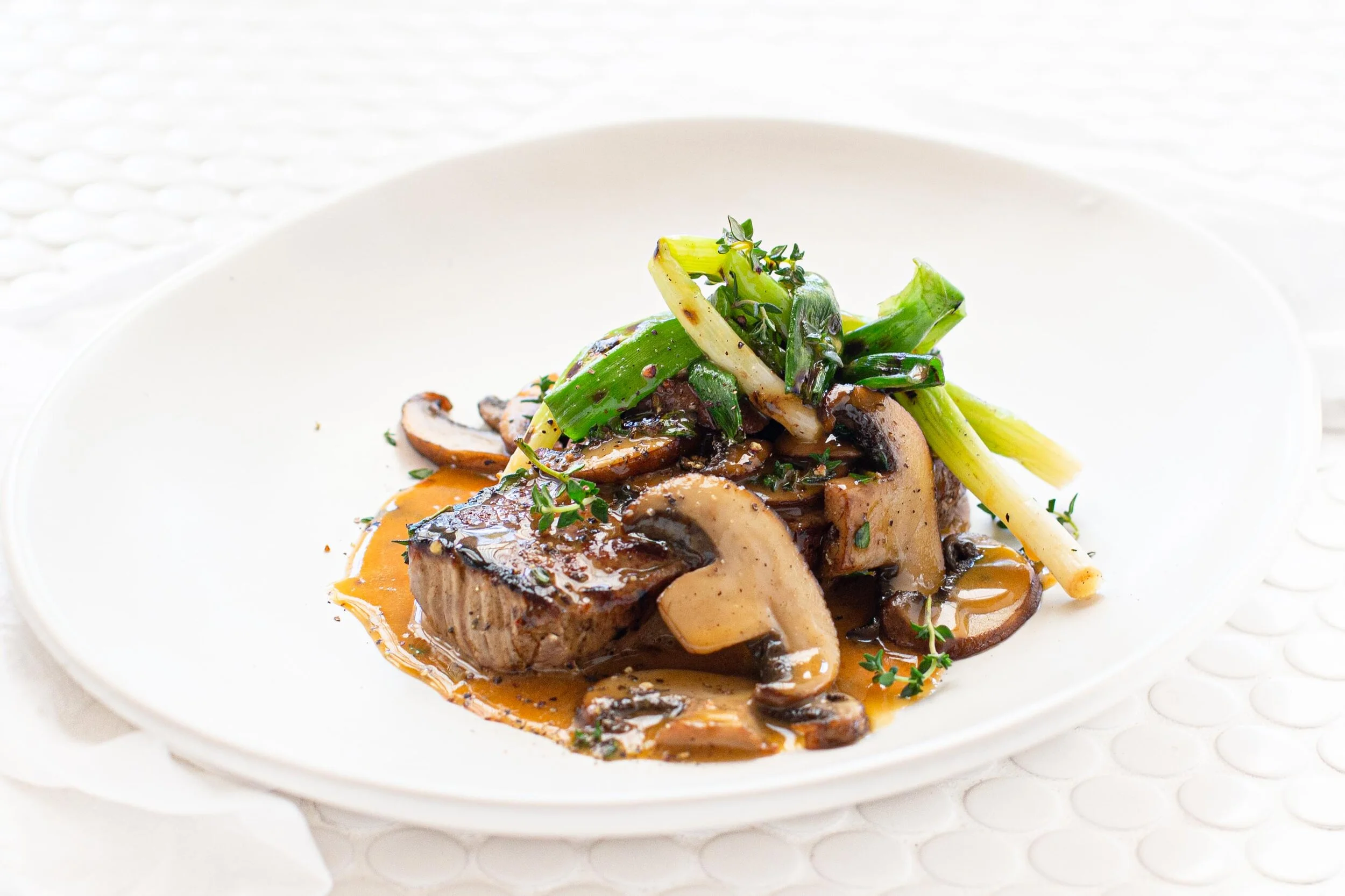 Porterhouse Steak with Mushroom Sauce &amp; Charred Spring Onions