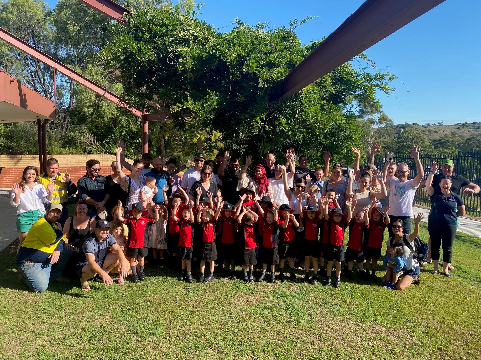 New Kindy 2023 families hands in the air.jpg