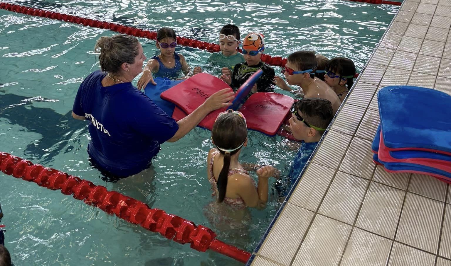 Jocelyn with advanced group swim school.jpg