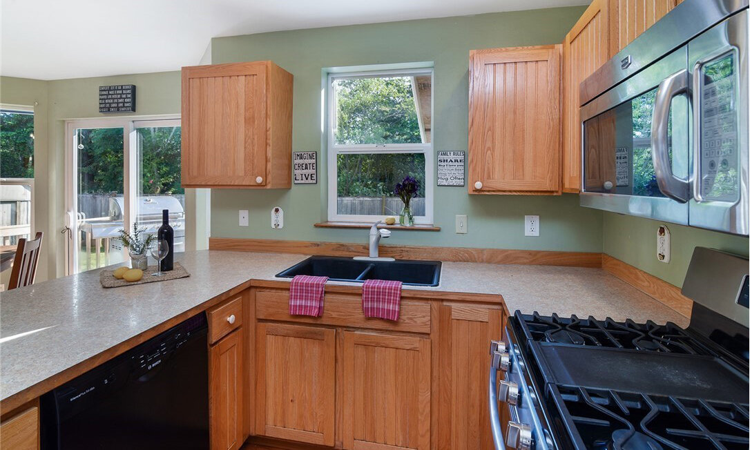  interior of kitchen with windows and sliding glass door 