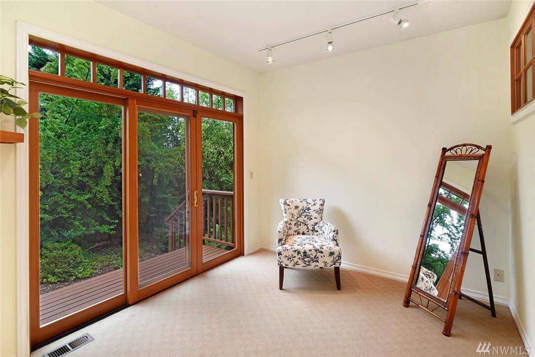  interior of room with sliding glass door and chair 