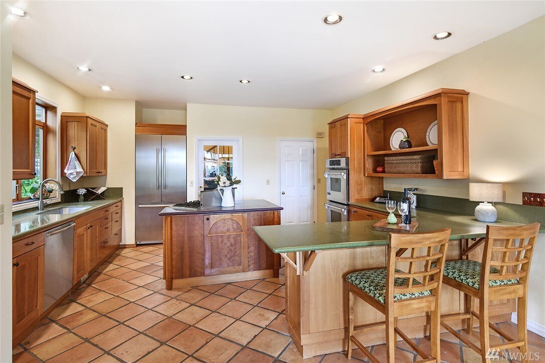  interior of kitchen with island and dining table 
