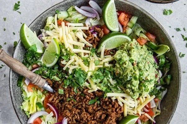 Keto taco salad with salsa dressing and guacamole