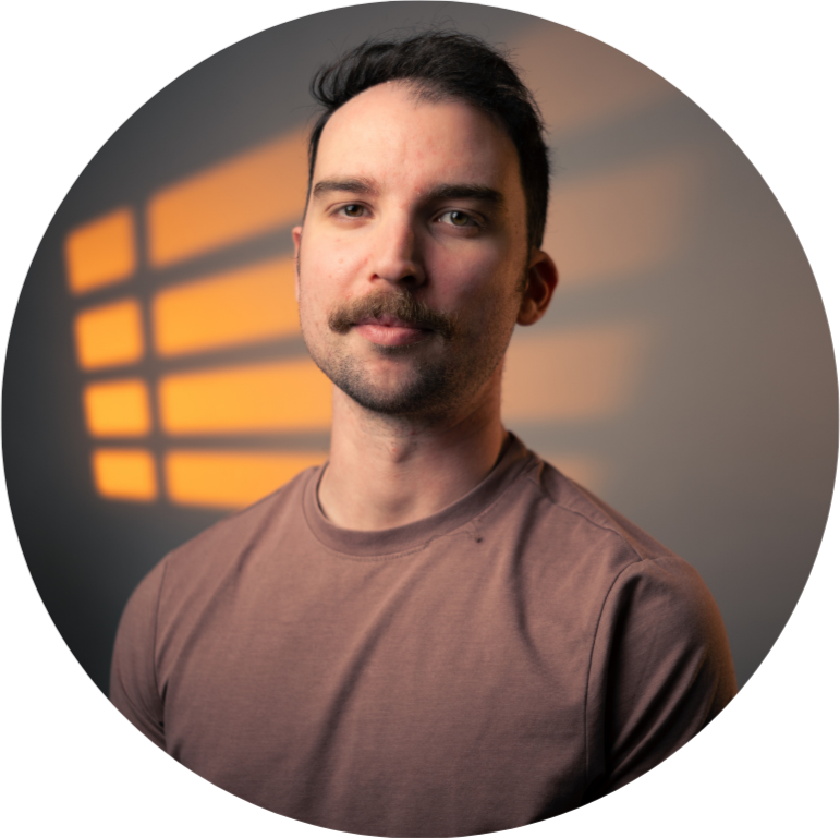 Person holding a video camera setup with a microphone.